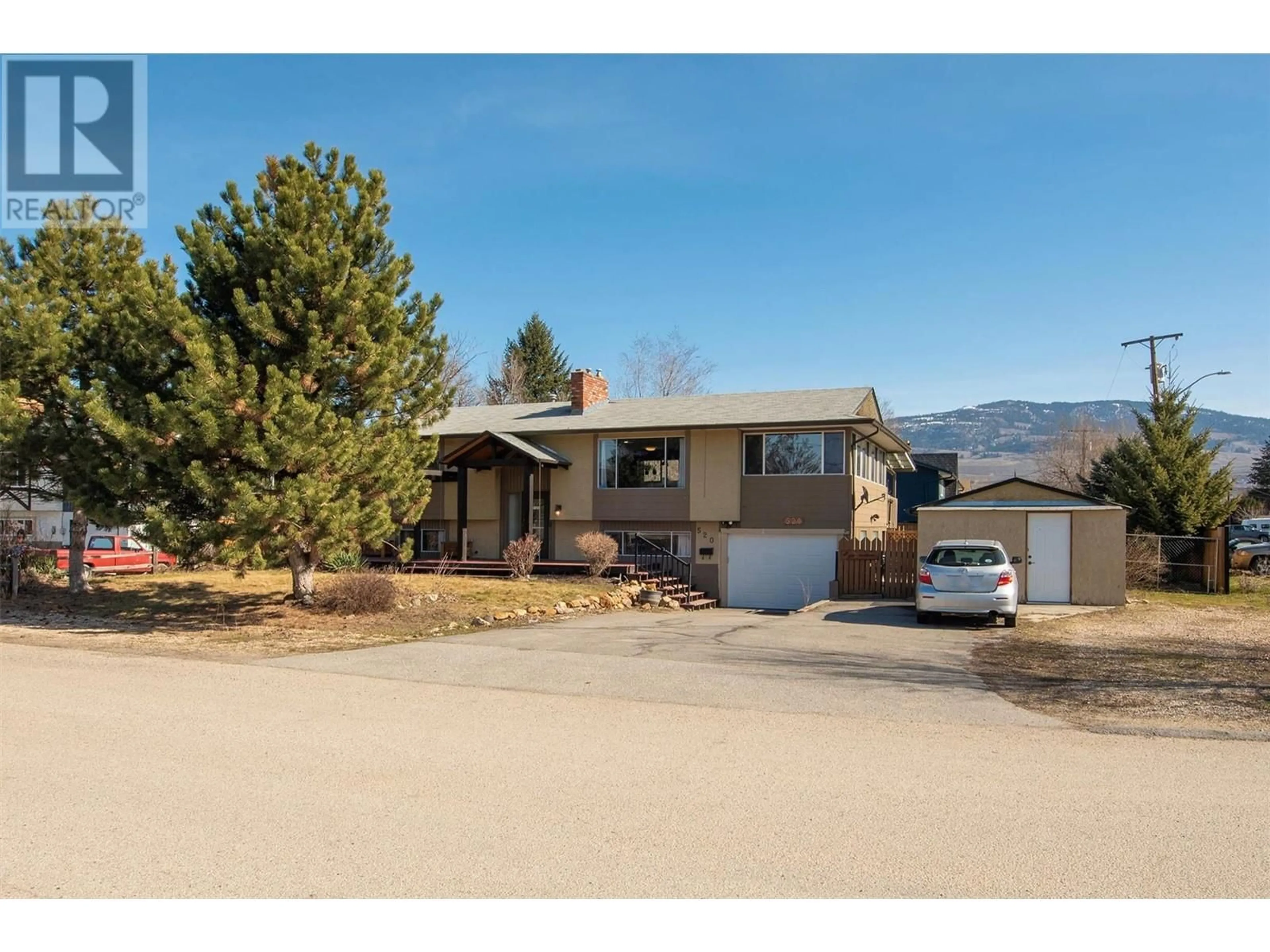 Frontside or backside of a home, the street view for 520 Keithley Road, Kelowna British Columbia V1X2N7