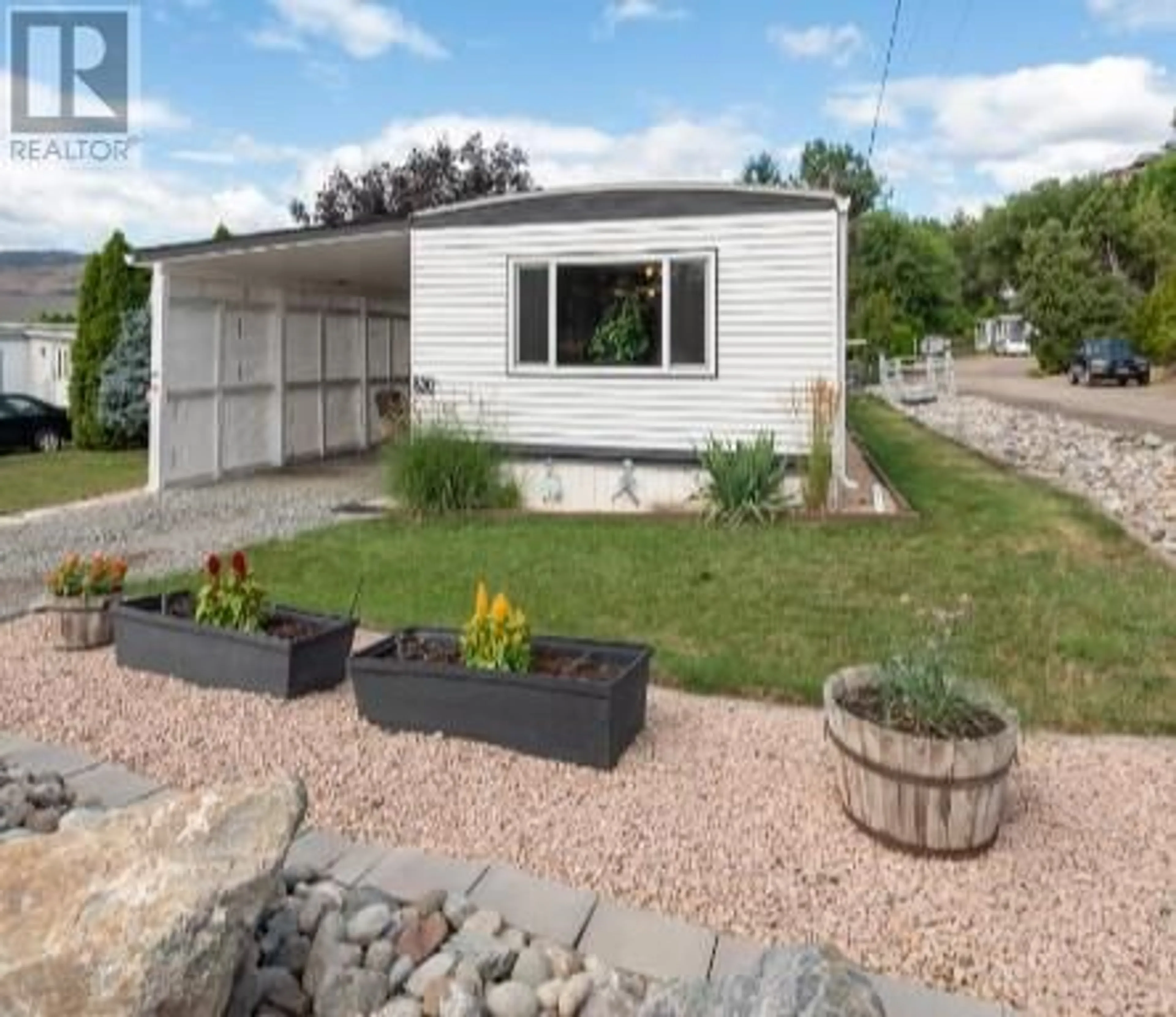 Frontside or backside of a home, the fenced backyard for 3206 Shannon Lake Road Unit# 20, West Kelowna British Columbia V4T1V4