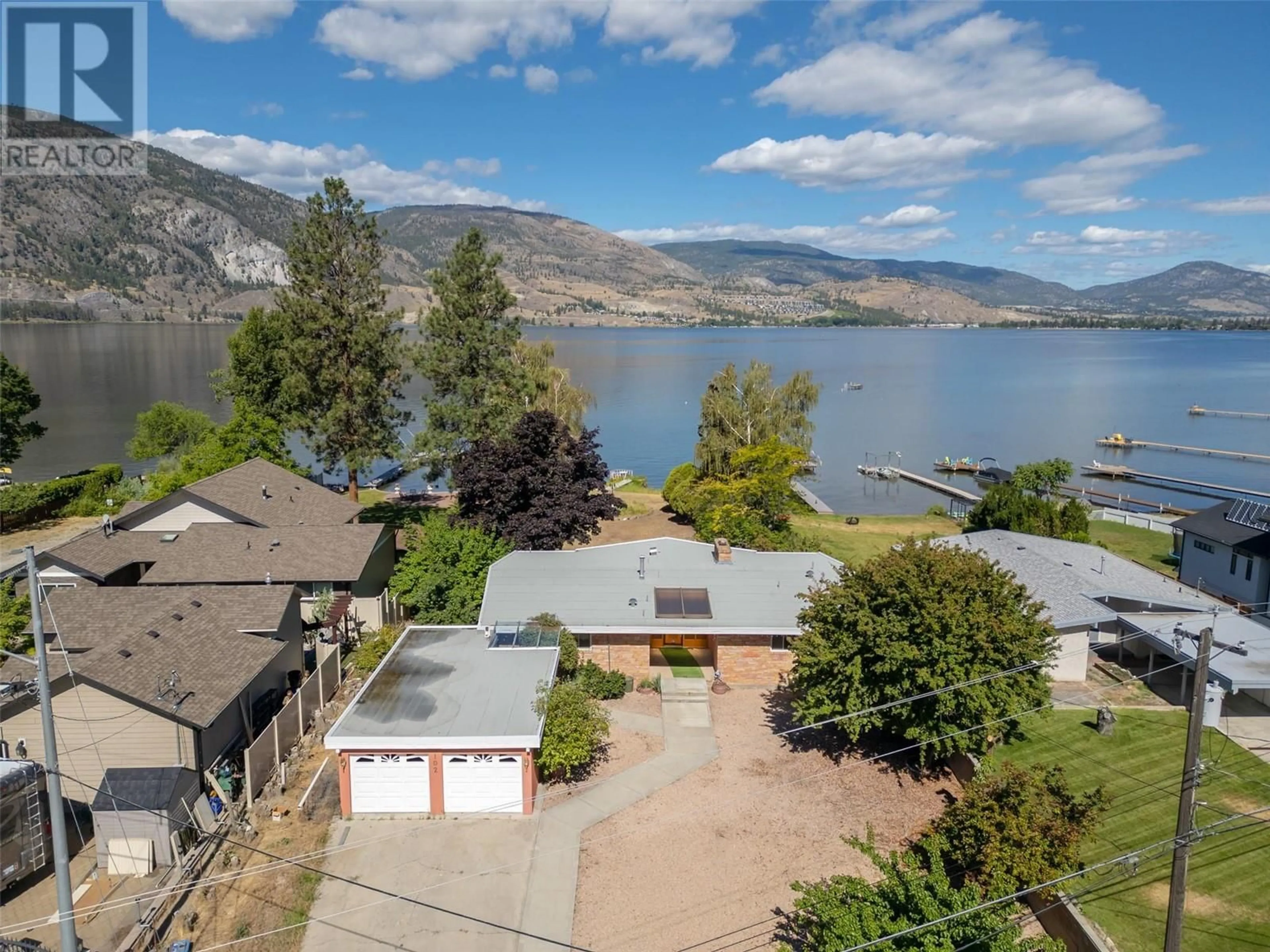 A pic from exterior of the house or condo, lake for 102 Derenzy Place, Penticton British Columbia V2A8W7