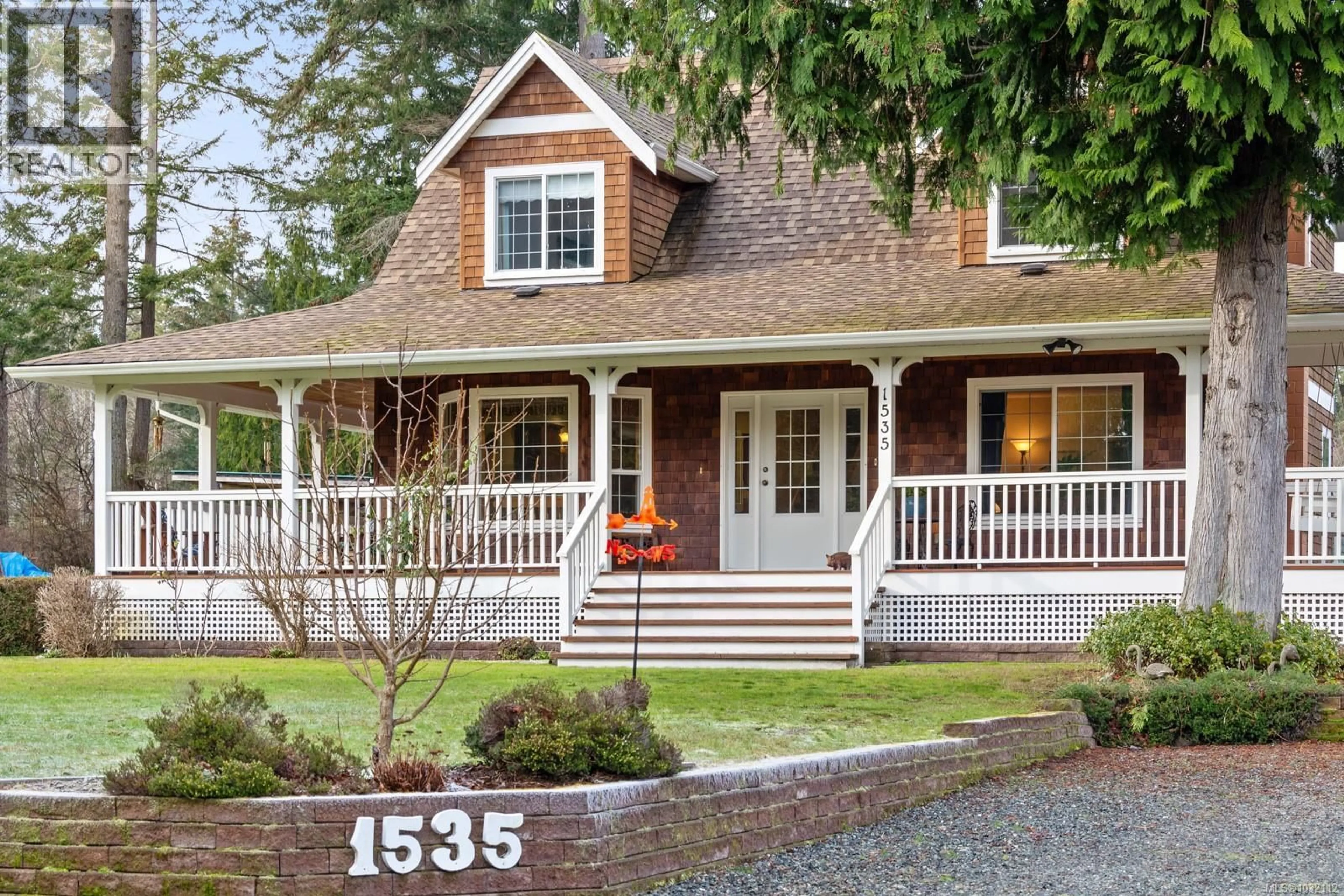 Home with vinyl exterior material, street for 1535 BAIKIE ROAD, Denman Island British Columbia V0R1T0