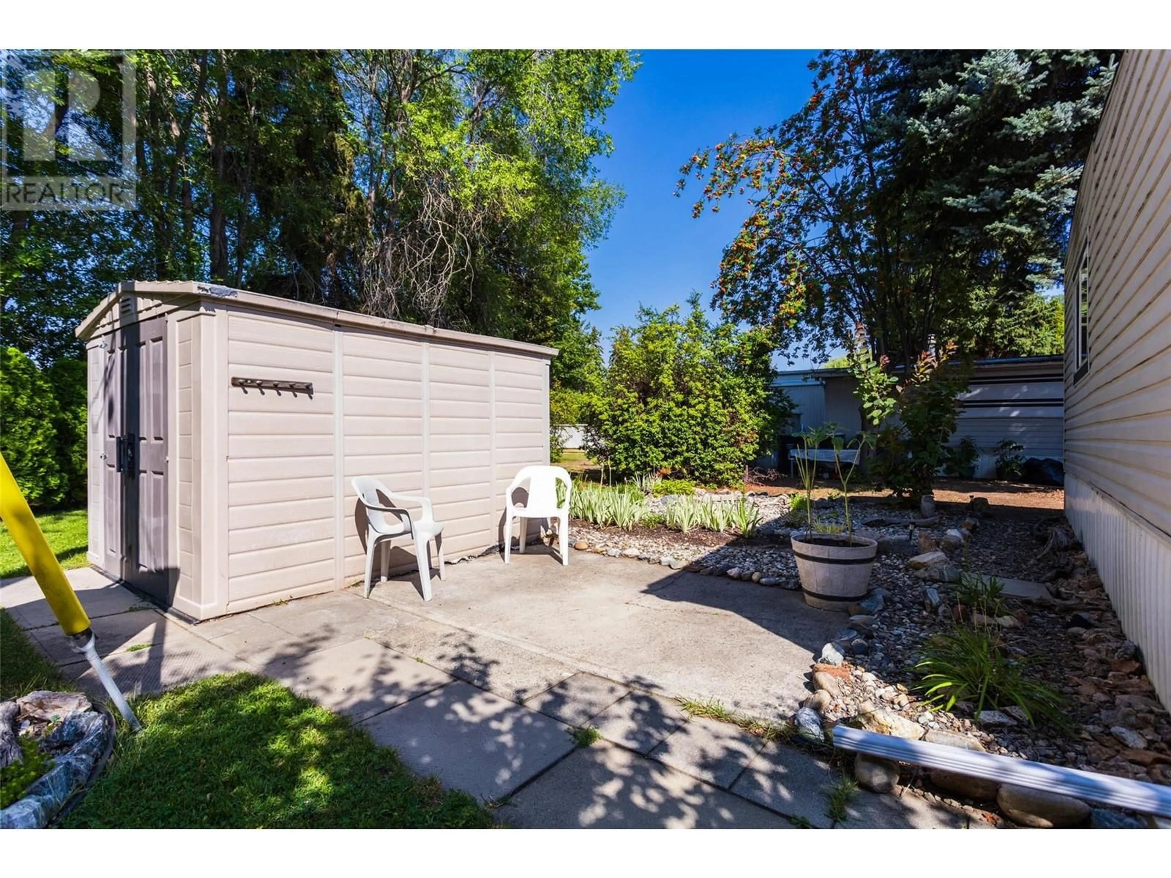 Patio, the fenced backyard for 3535 Casorso Road Unit# 4, Kelowna British Columbia V1W3E1