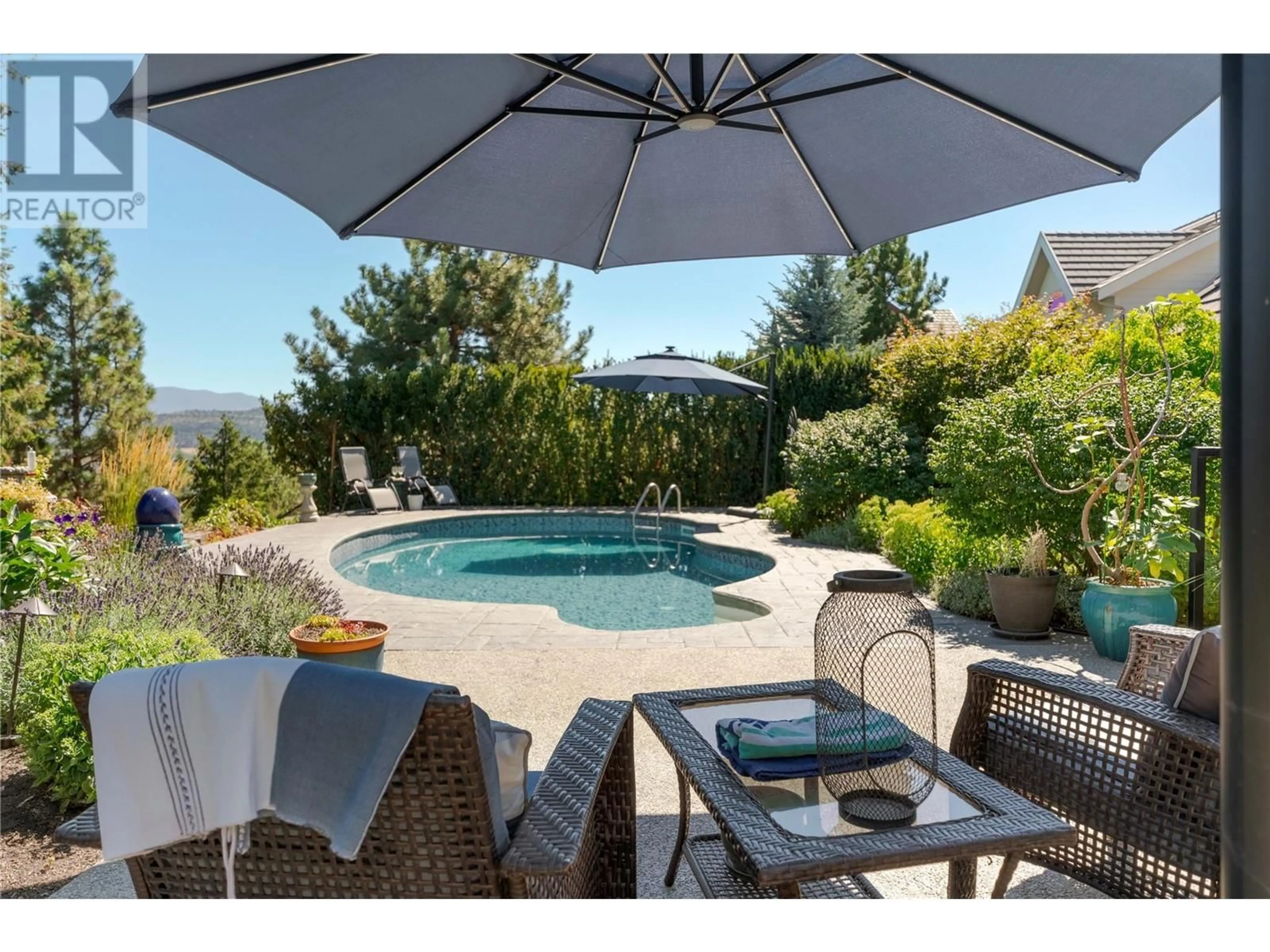 Patio, the fenced backyard for 559 Long Ridge Drive S, Kelowna British Columbia V1V2R9