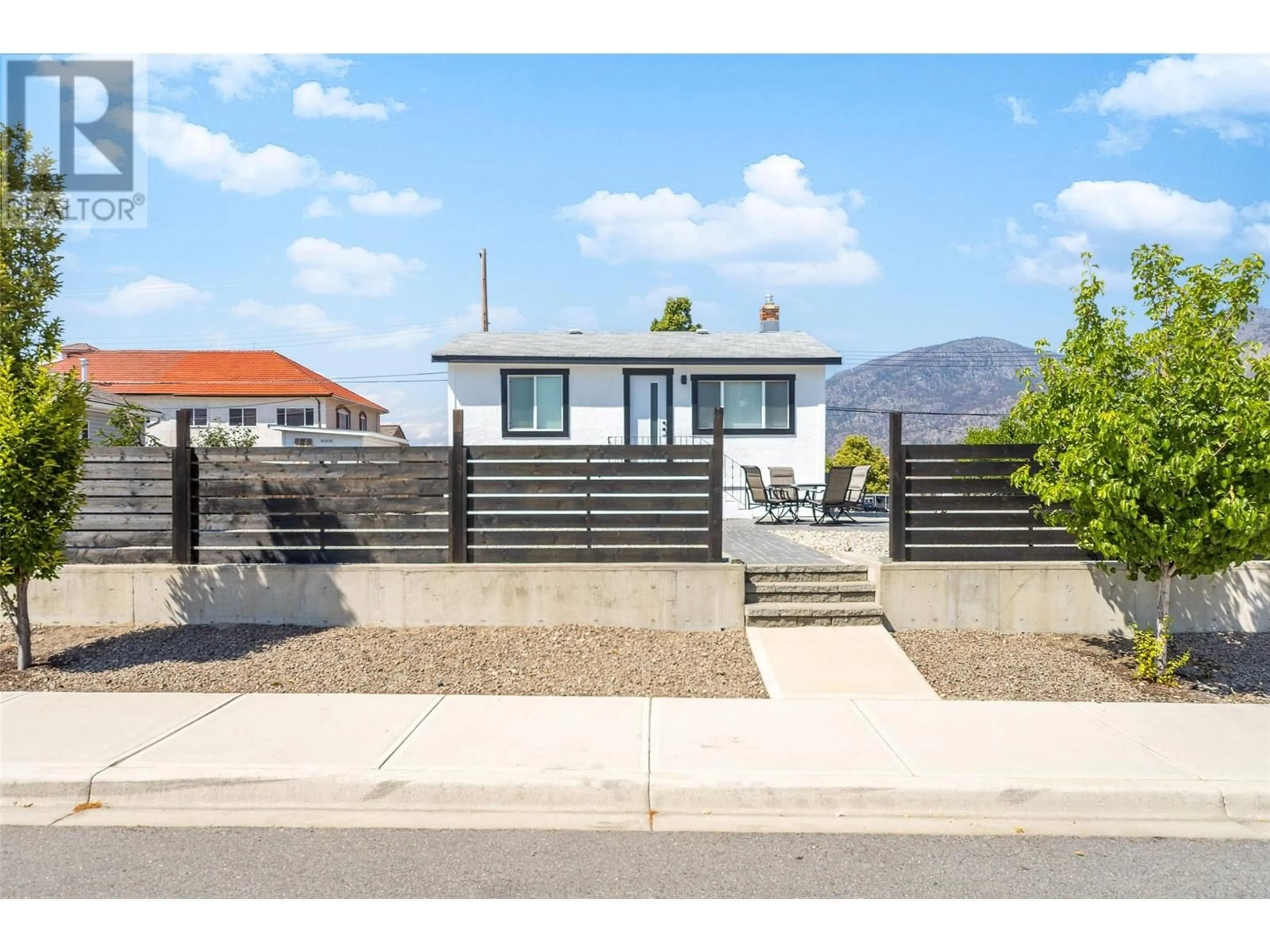 Home with vinyl exterior material, street for 8706 74TH AVENUE, Osoyoos British Columbia V1H1V0
