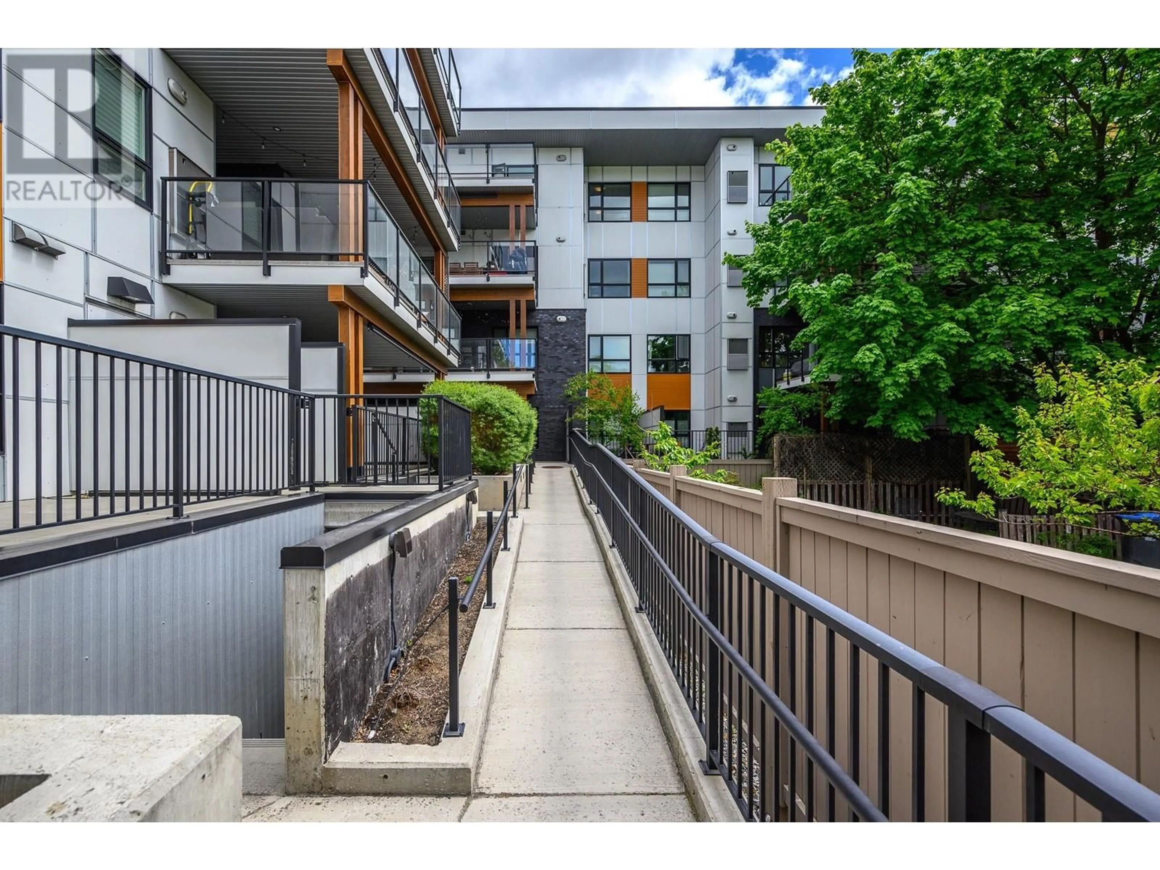 A pic from exterior of the house or condo, the street view for 1883 Water Street Unit# 405, Kelowna British Columbia V1Y1K4