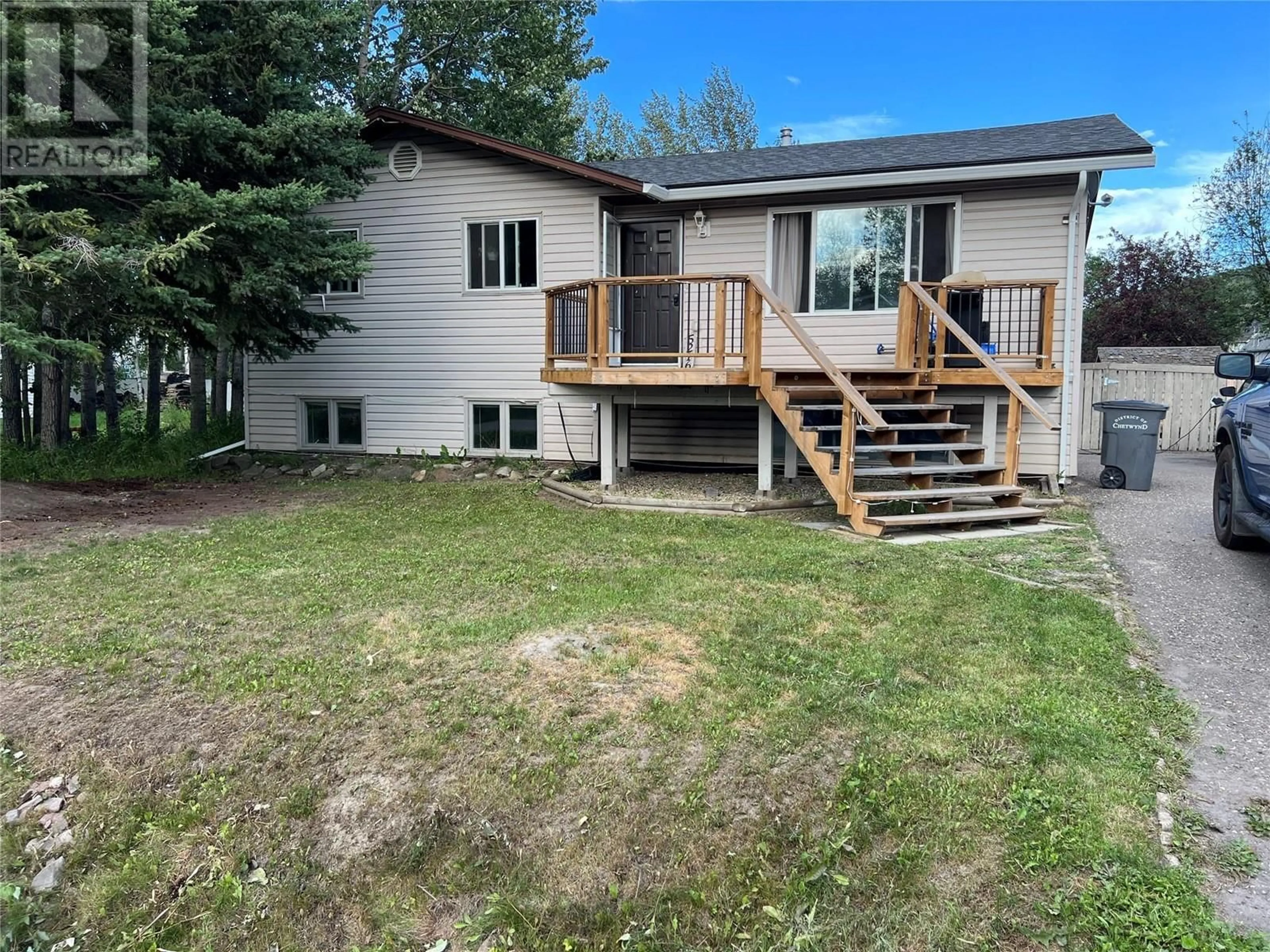 Frontside or backside of a home, the fenced backyard for 5216 42 Street NE, Chetwynd British Columbia V0C1J0