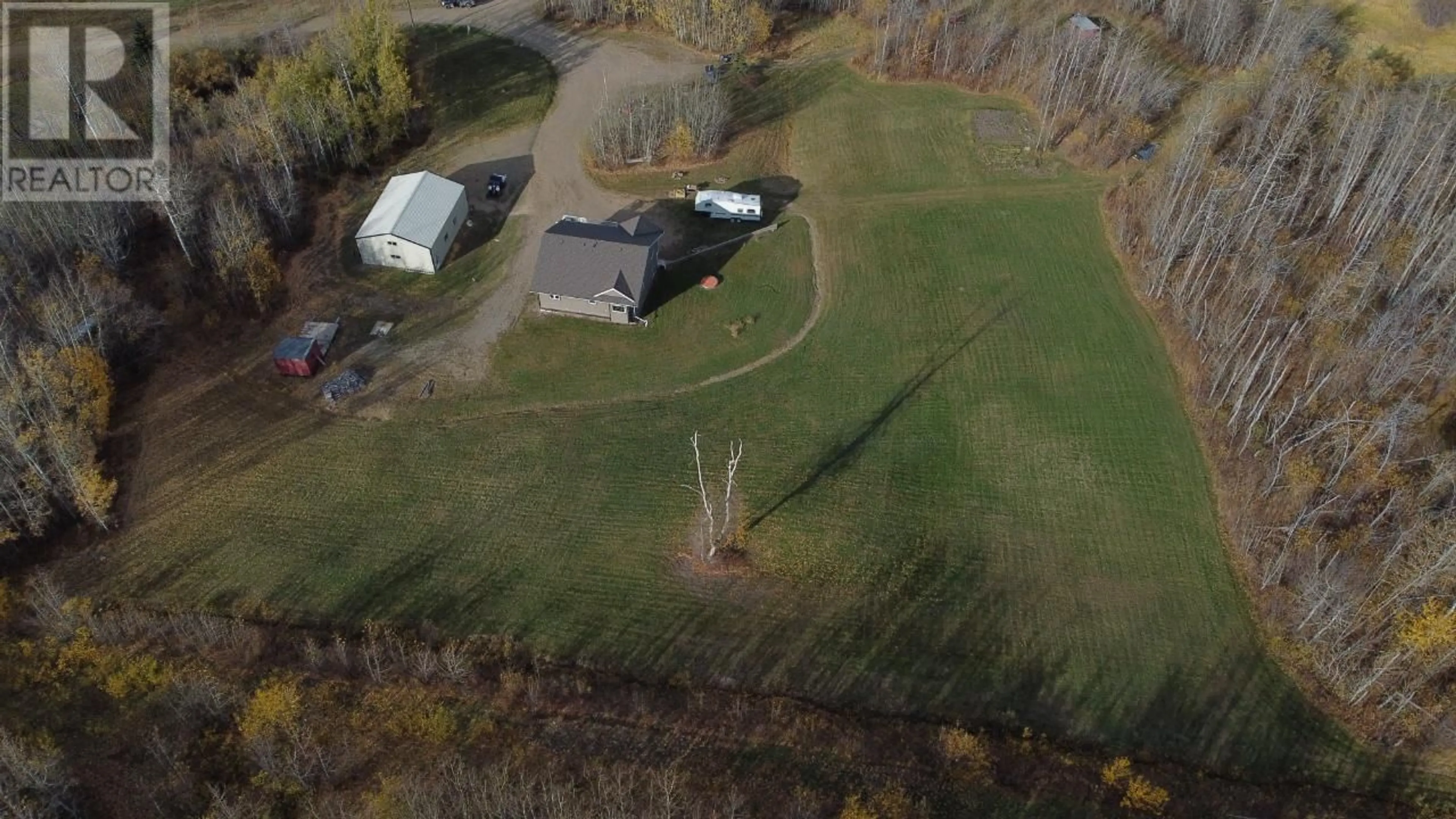 Frontside or backside of a home, the fenced backyard for 13040 Prince Subdivision, Dawson Creek British Columbia V1G0C2