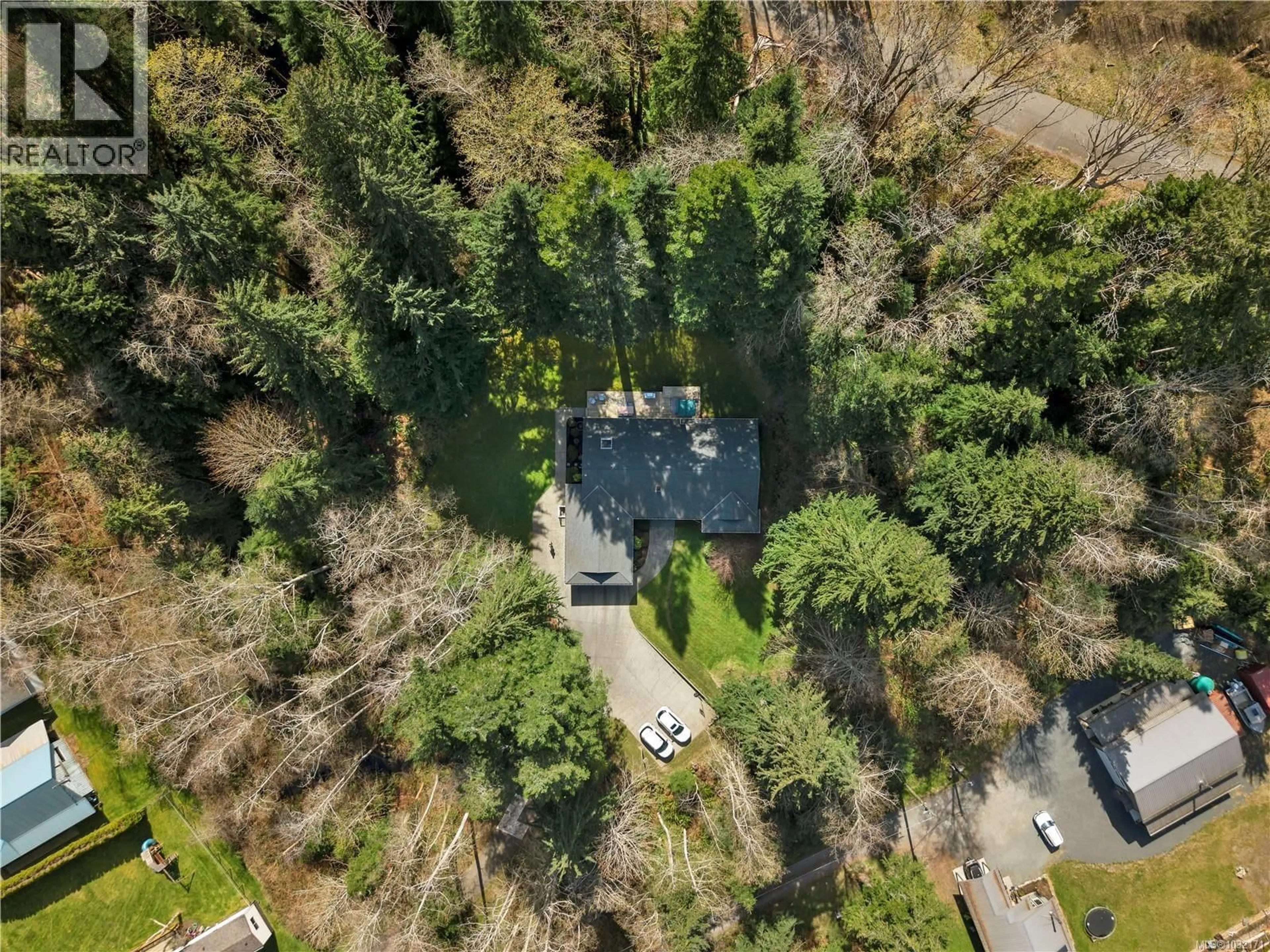 A pic from outside/outdoor area/front of a property/back of a property/a pic from drone, forest/trees view for 670 HOMEWOOD ROAD, Campbell River British Columbia V9W3N5