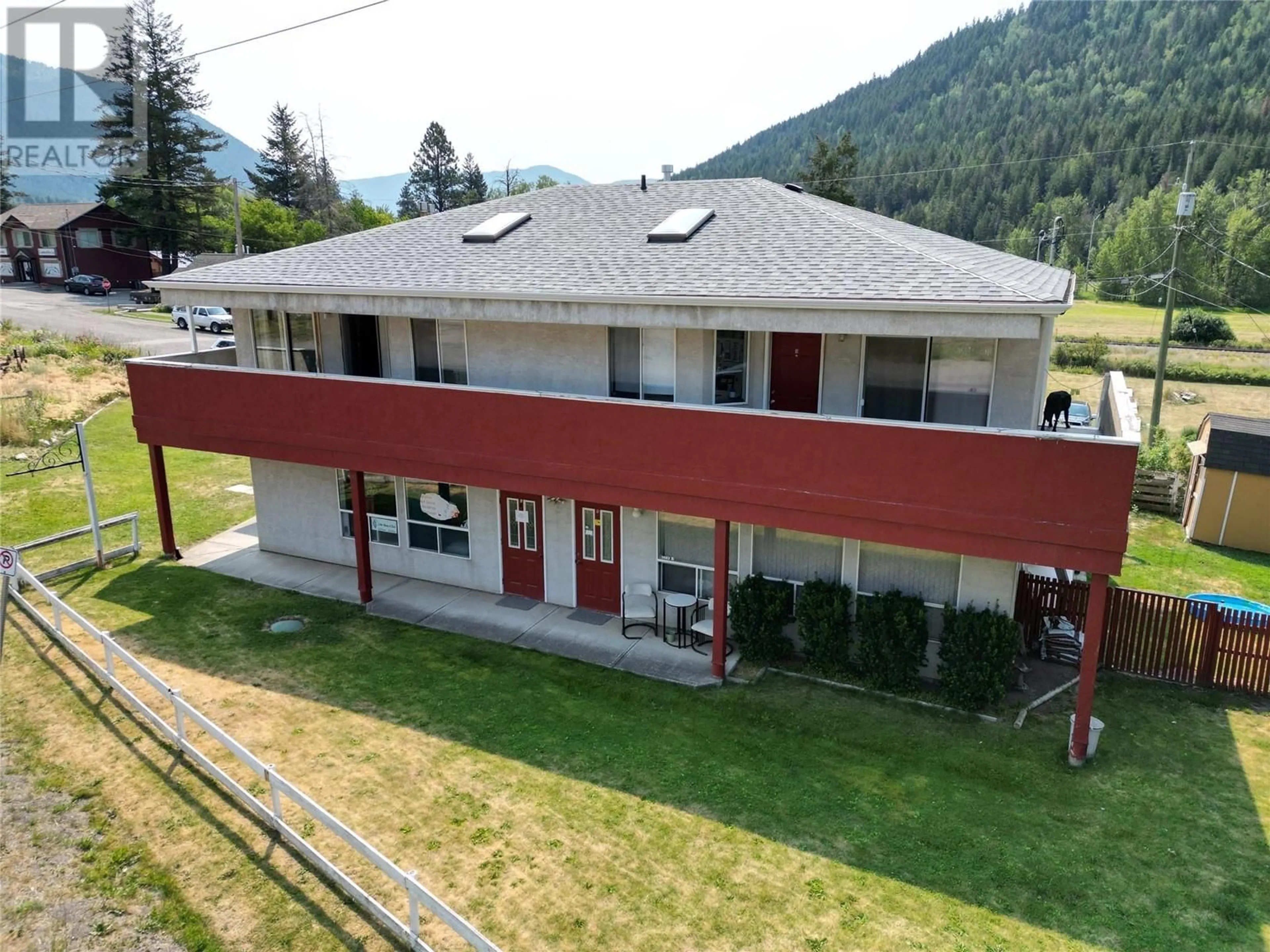 A pic from outside/outdoor area/front of a property/back of a property/a pic from drone, mountain view for 5683 97N Highway, Falkland British Columbia V0E1W0