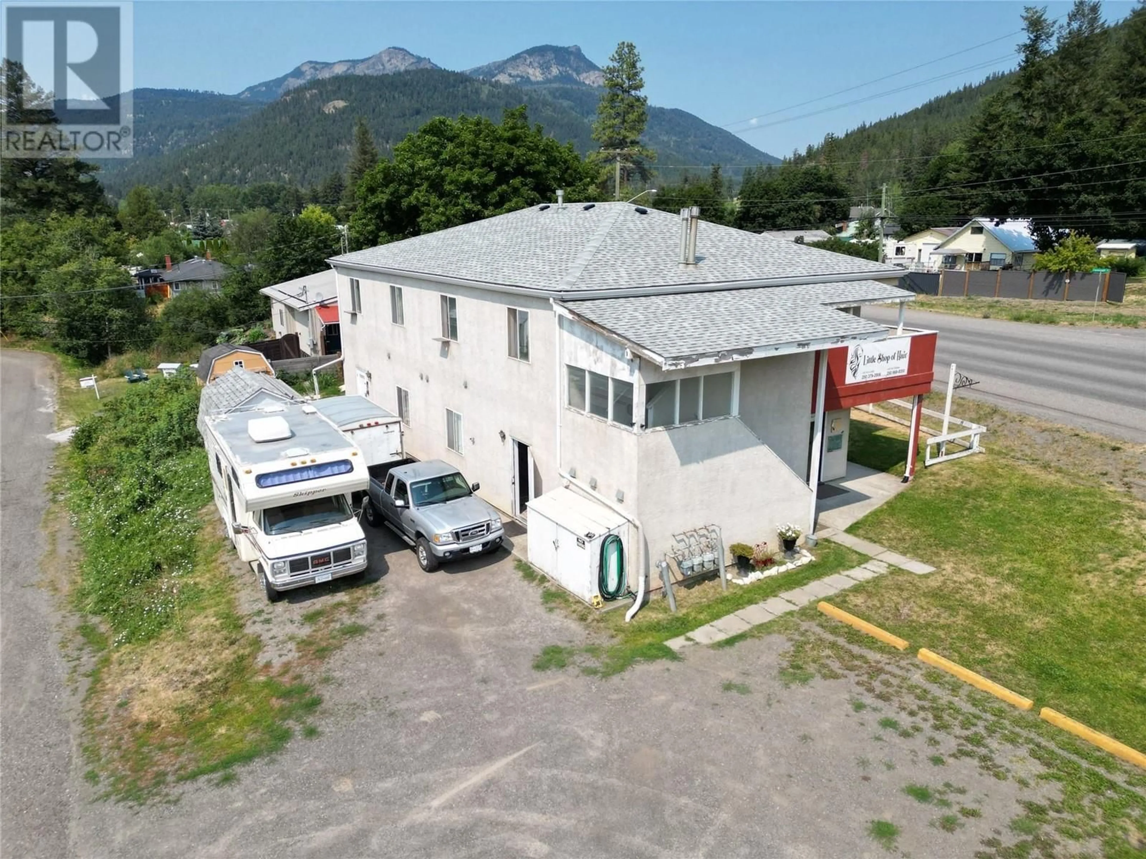 A pic from outside/outdoor area/front of a property/back of a property/a pic from drone, mountain view for 5683 97N Highway, Falkland British Columbia V0E1W0