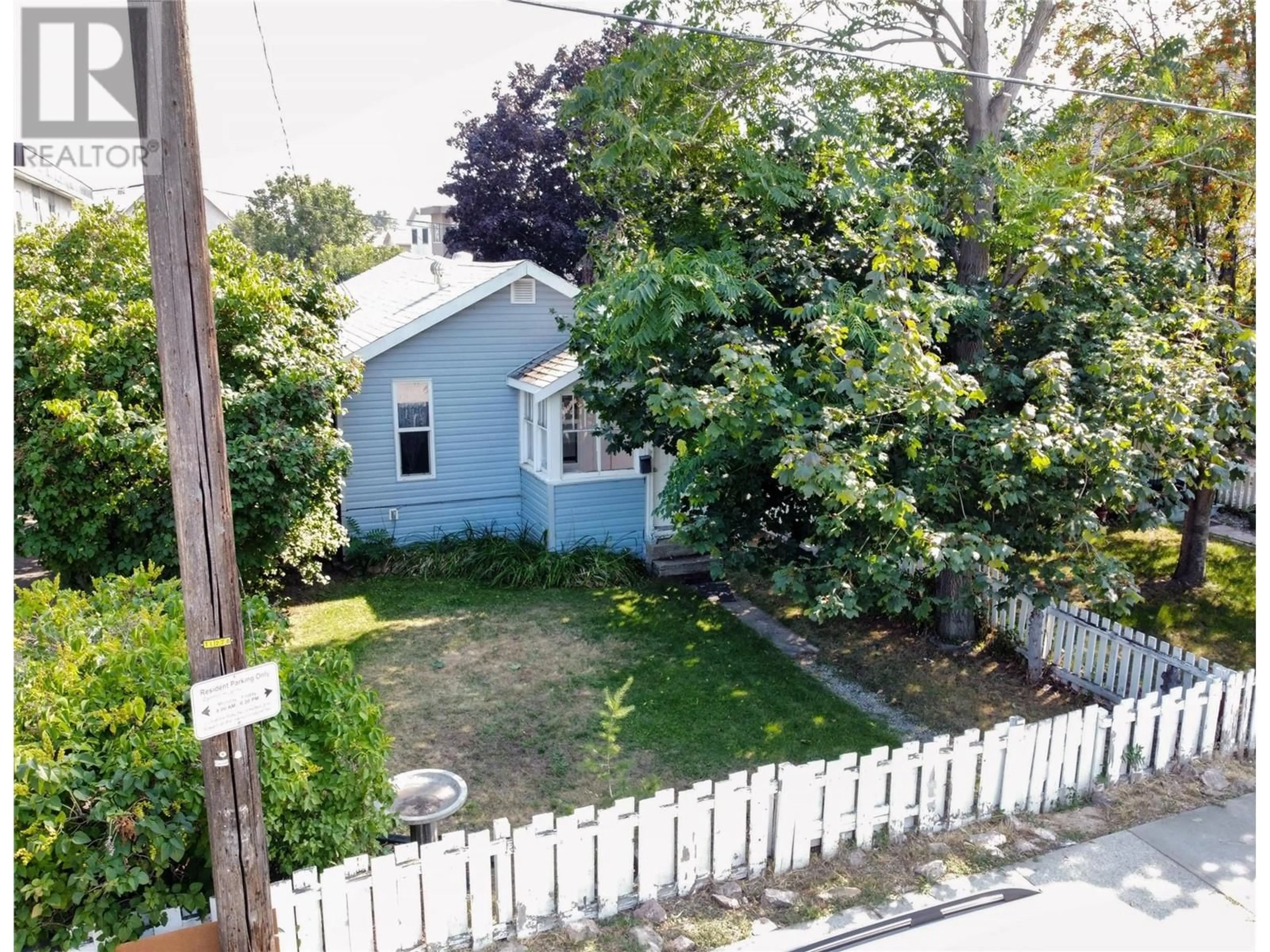 Frontside or backside of a home, the fenced backyard for 362 Nanaimo Avenue W, Penticton British Columbia V2A1N7