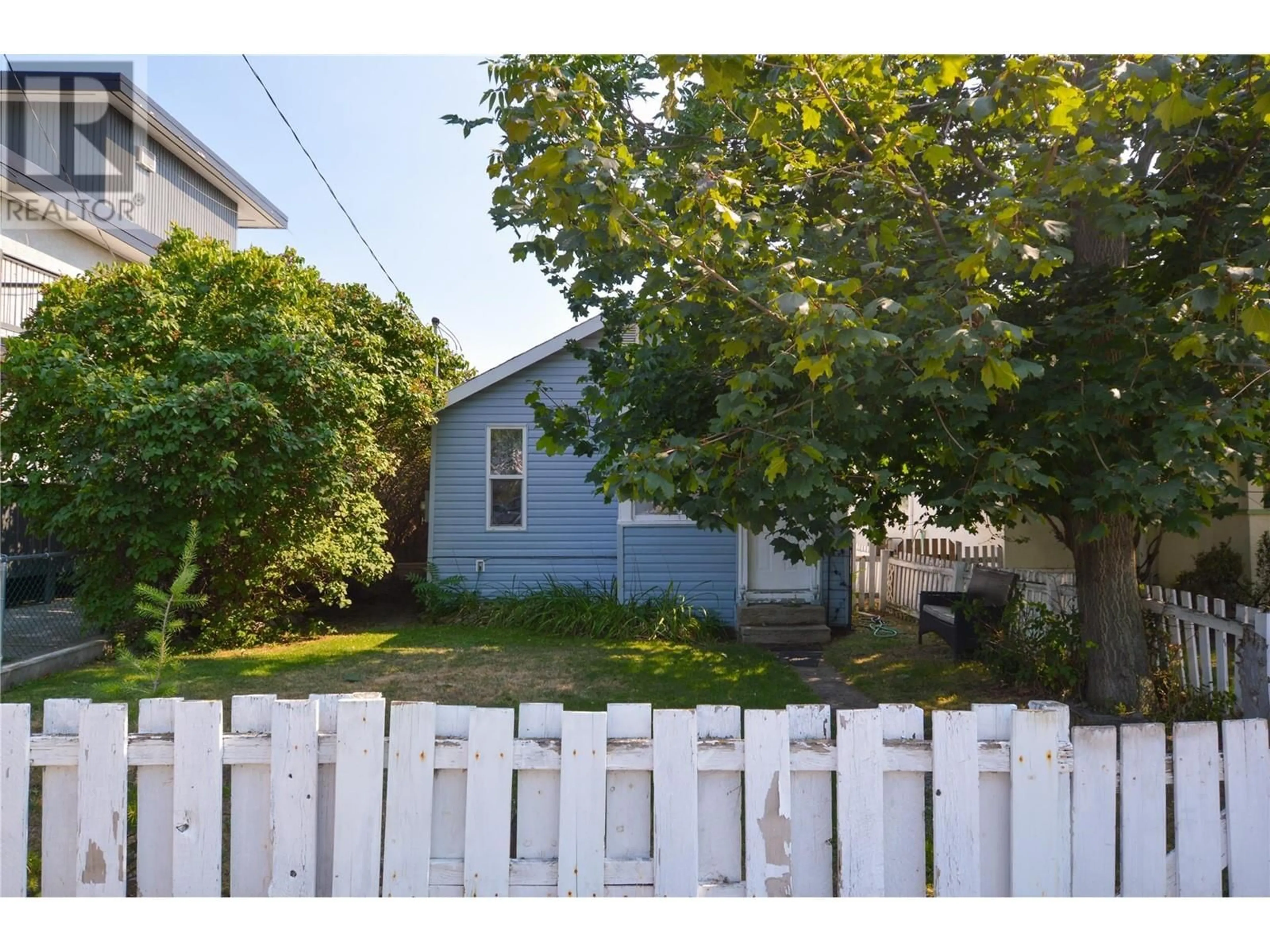 Frontside or backside of a home, the fenced backyard for 362 Nanaimo Avenue W, Penticton British Columbia V2A1N7