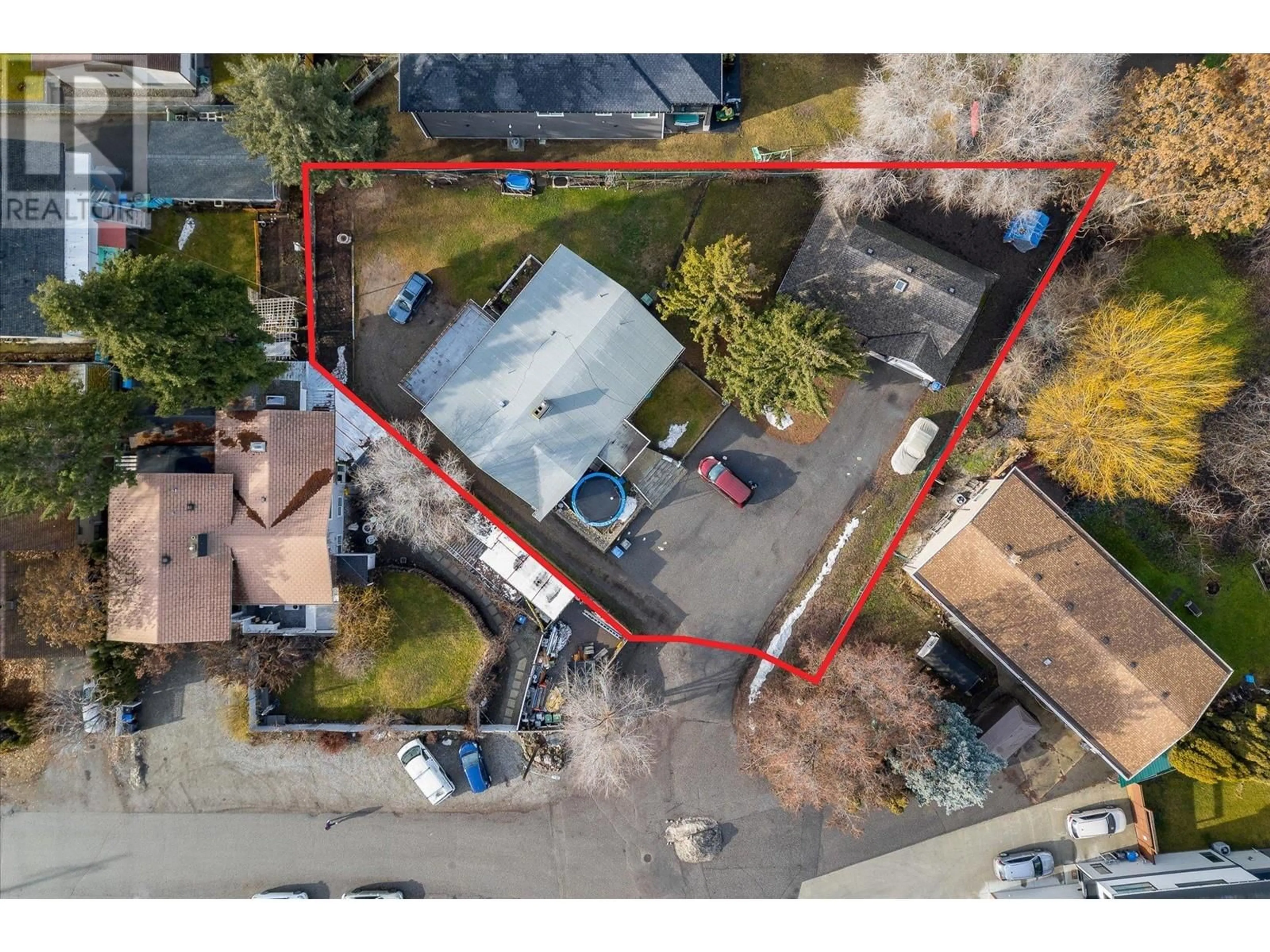 Frontside or backside of a home, the fenced backyard for 1402 / 1404 Inkar Road Lot# 1 & 2, Kelowna British Columbia V1Y8H7