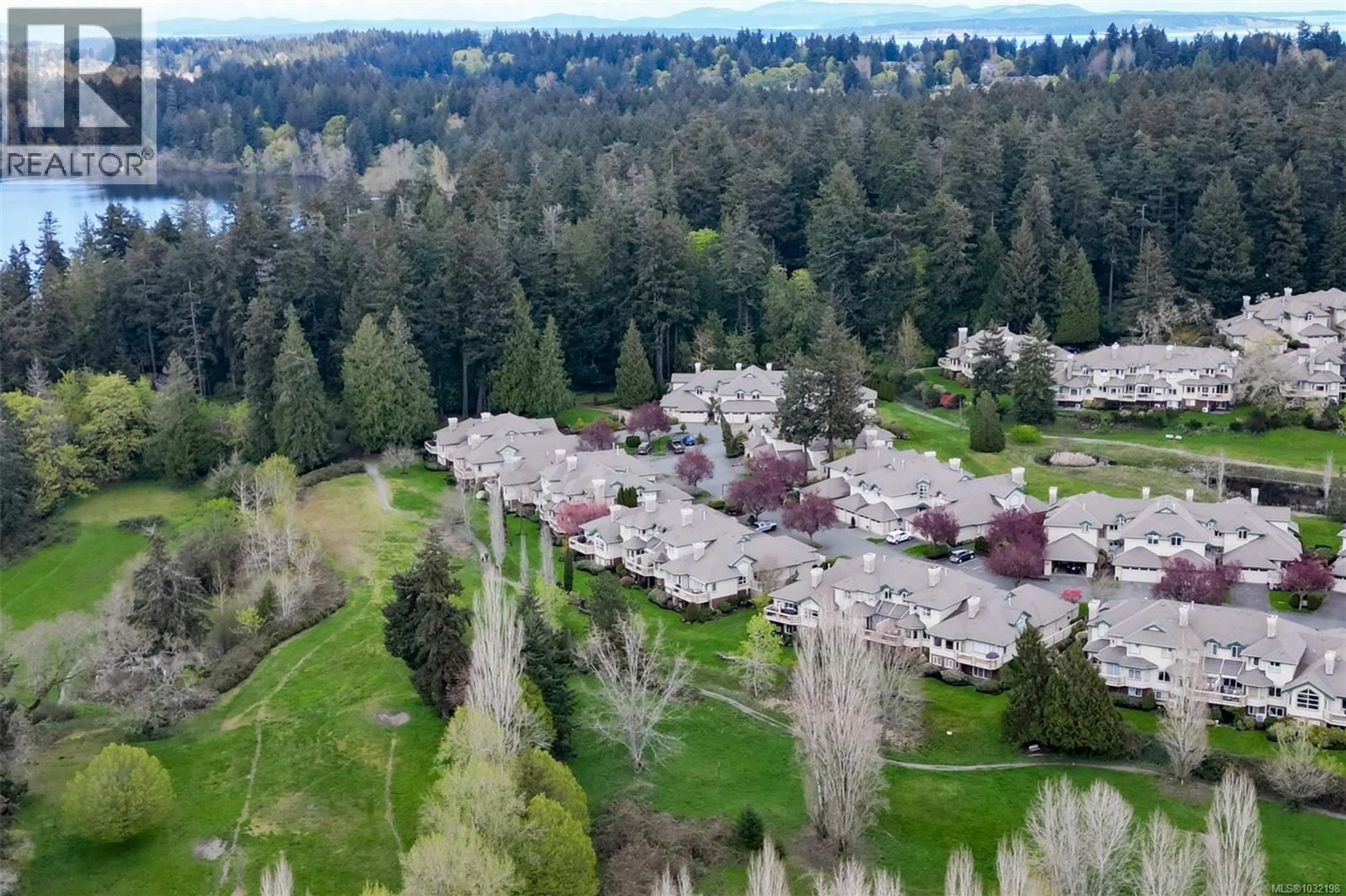 A pic from outside/outdoor area/front of a property/back of a property/a pic from drone, forest/trees view for 66 - 530 MARSETT PLACE, Saanich British Columbia V8Z7J2