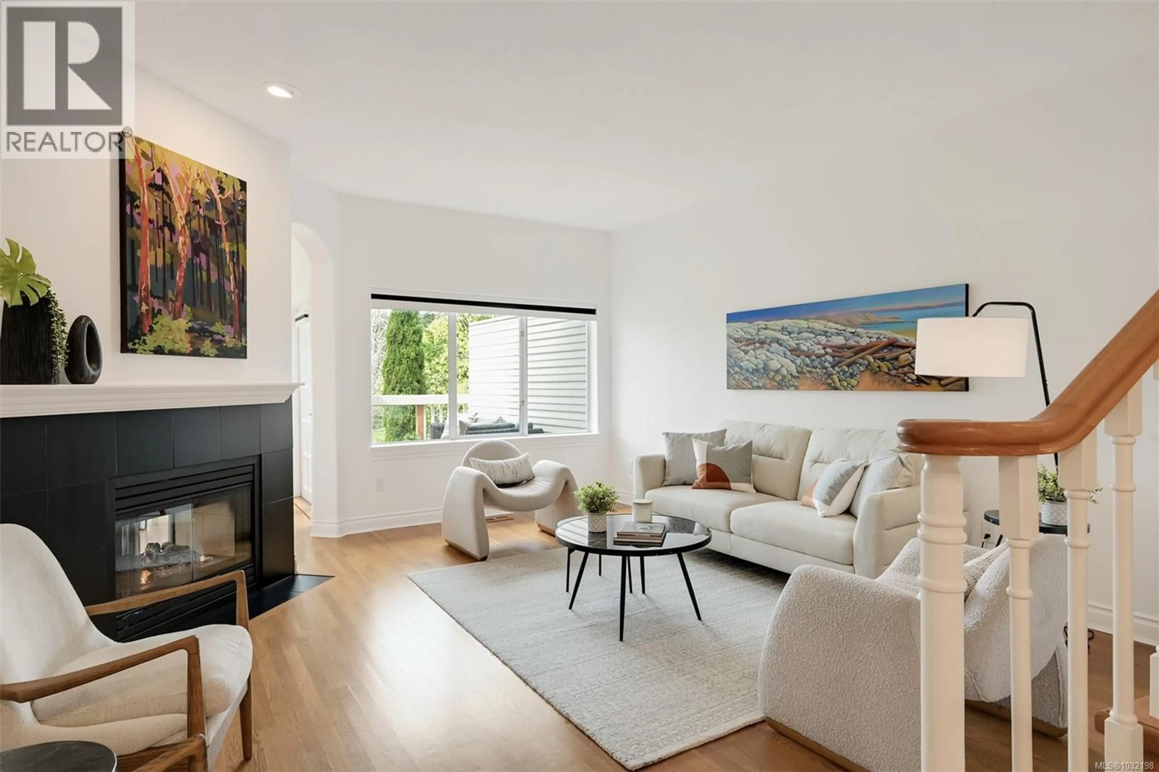 Living room with furniture, wood/laminate floor for 66 - 530 MARSETT PLACE, Saanich British Columbia V8Z7J2