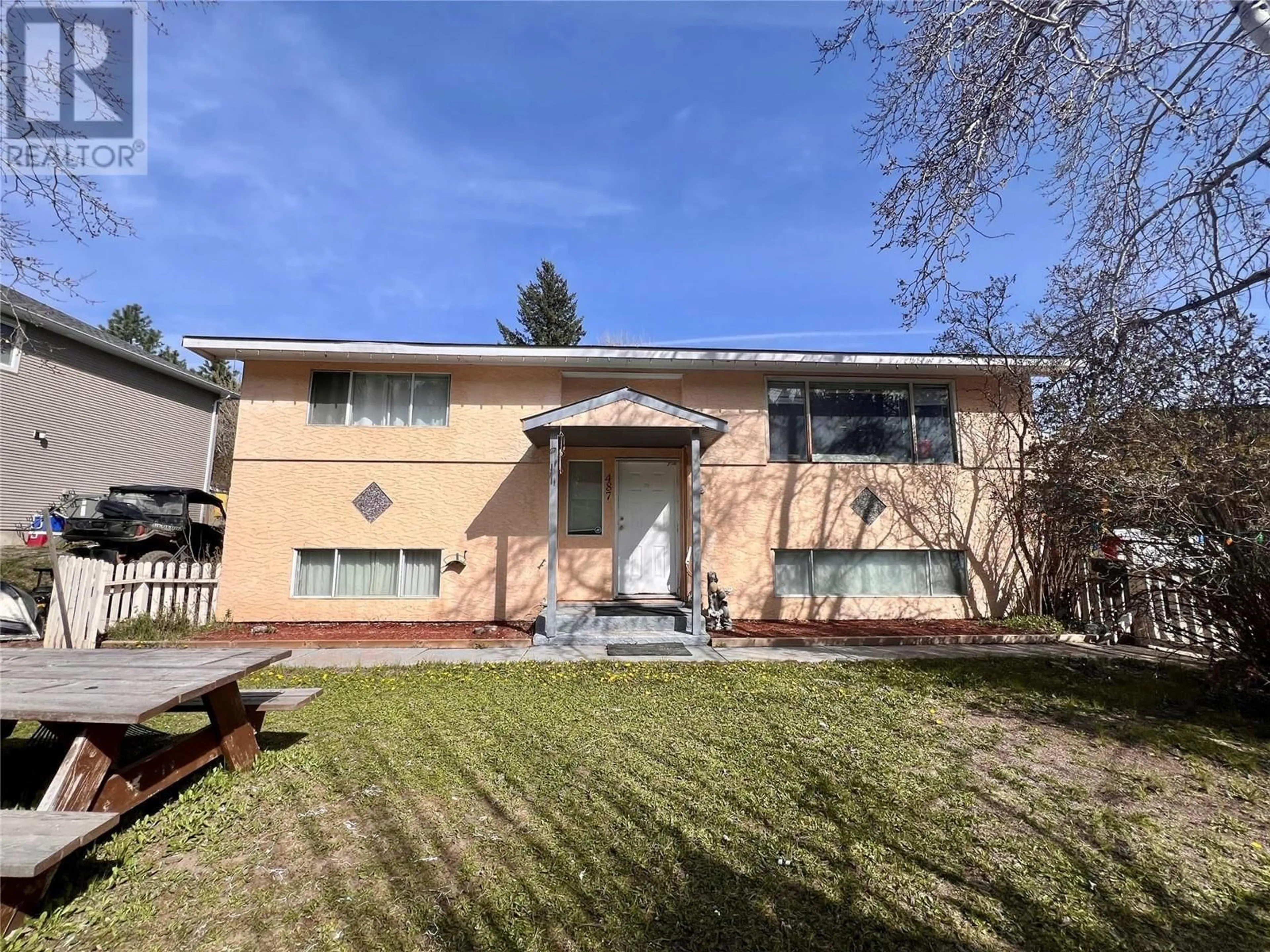 Frontside or backside of a home, the fenced backyard for 487 Corina Avenue, Princeton British Columbia V0X1W0