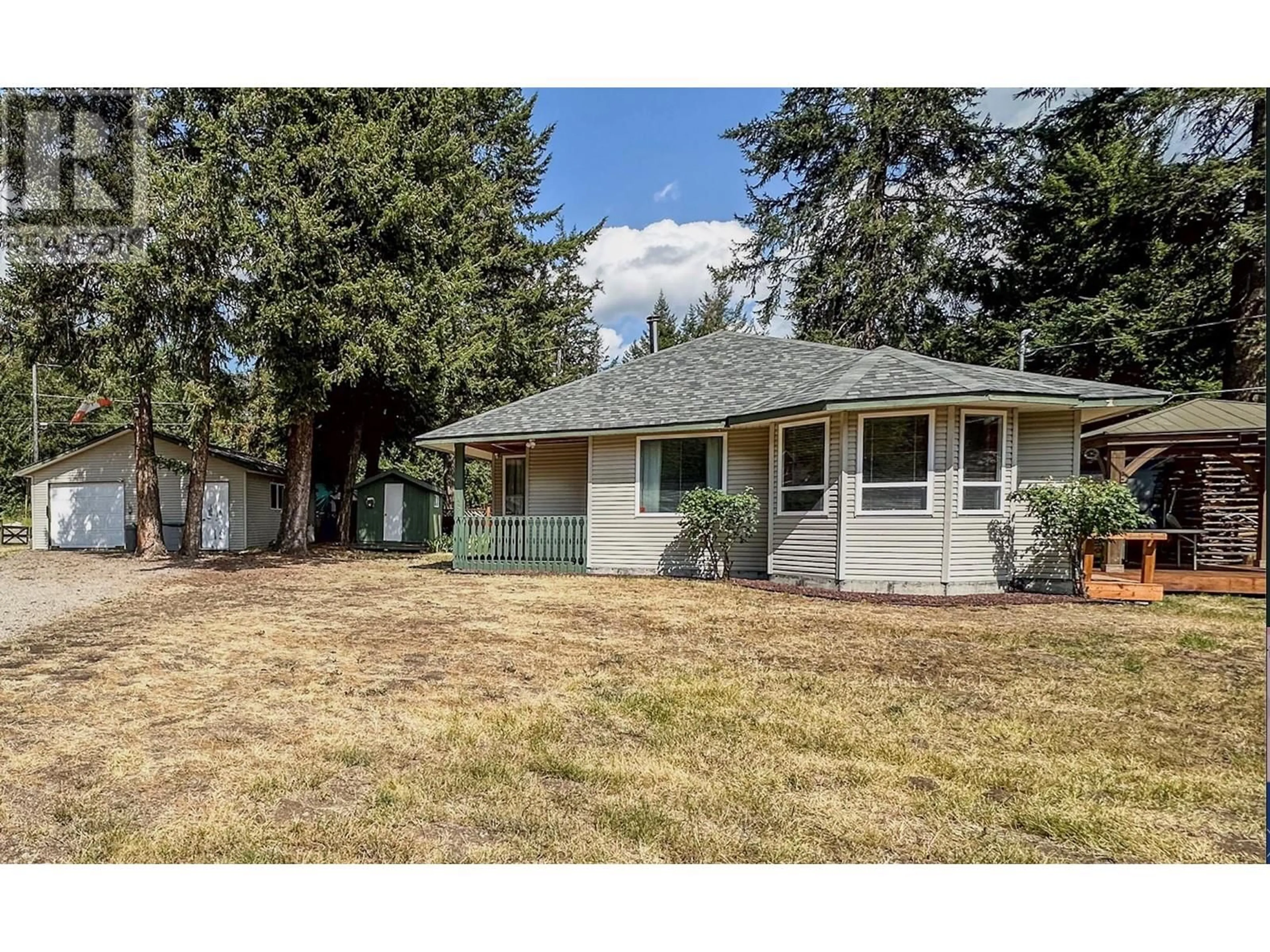 Frontside or backside of a home, the fenced backyard for 125 Missezula Lake Road, Princeton British Columbia V0X1W0