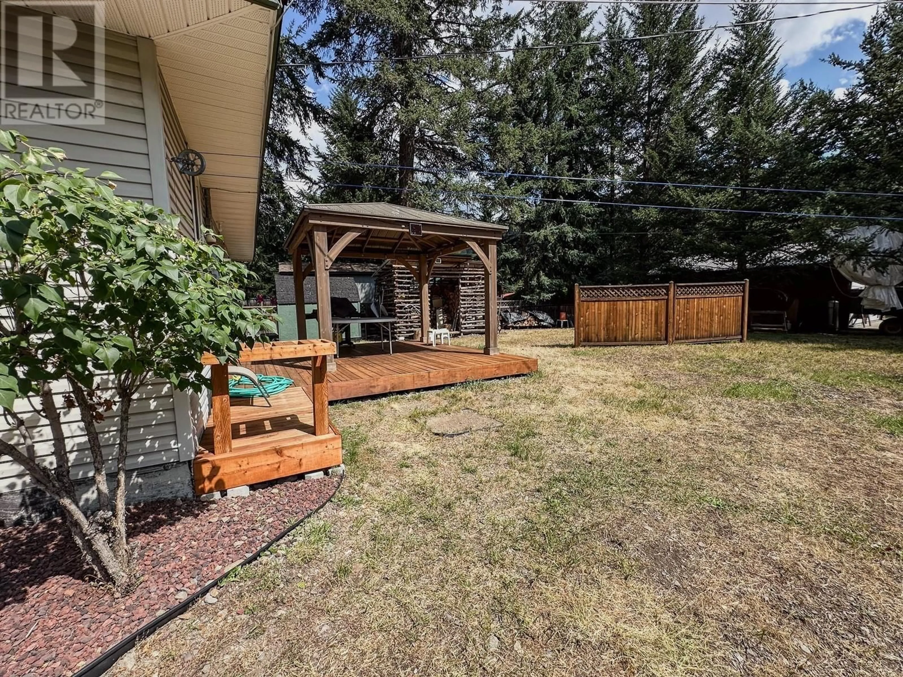 Patio, the fenced backyard for 125 Missezula Lake Road, Princeton British Columbia V0X1W0