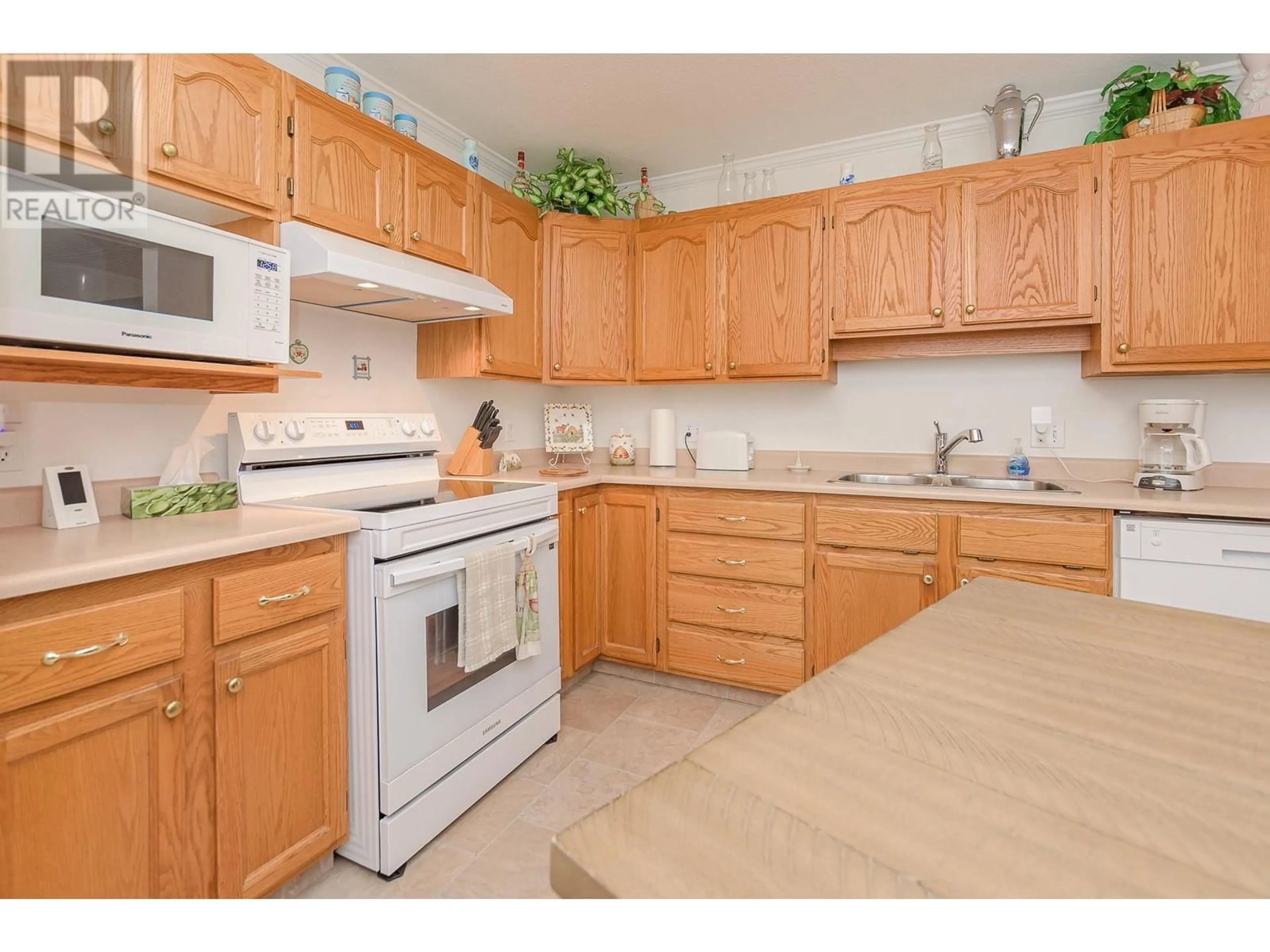 Standard kitchen, wood floors, cottage for 251 6 Street SE Unit# 107, Salmon Arm British Columbia V1E1J9