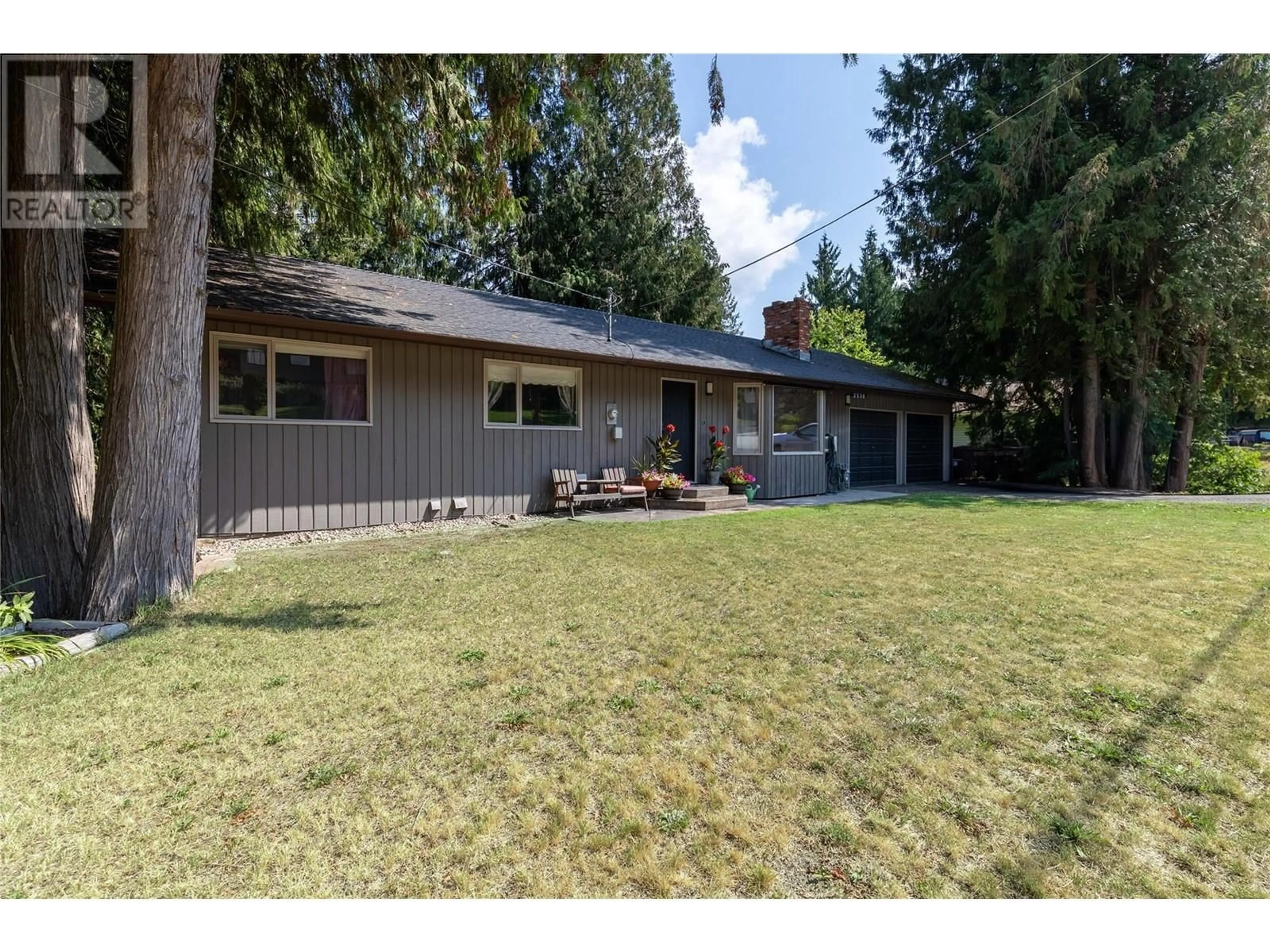 Frontside or backside of a home, the fenced backyard for 2539 Forest Drive, Blind Bay British Columbia V0E1H2