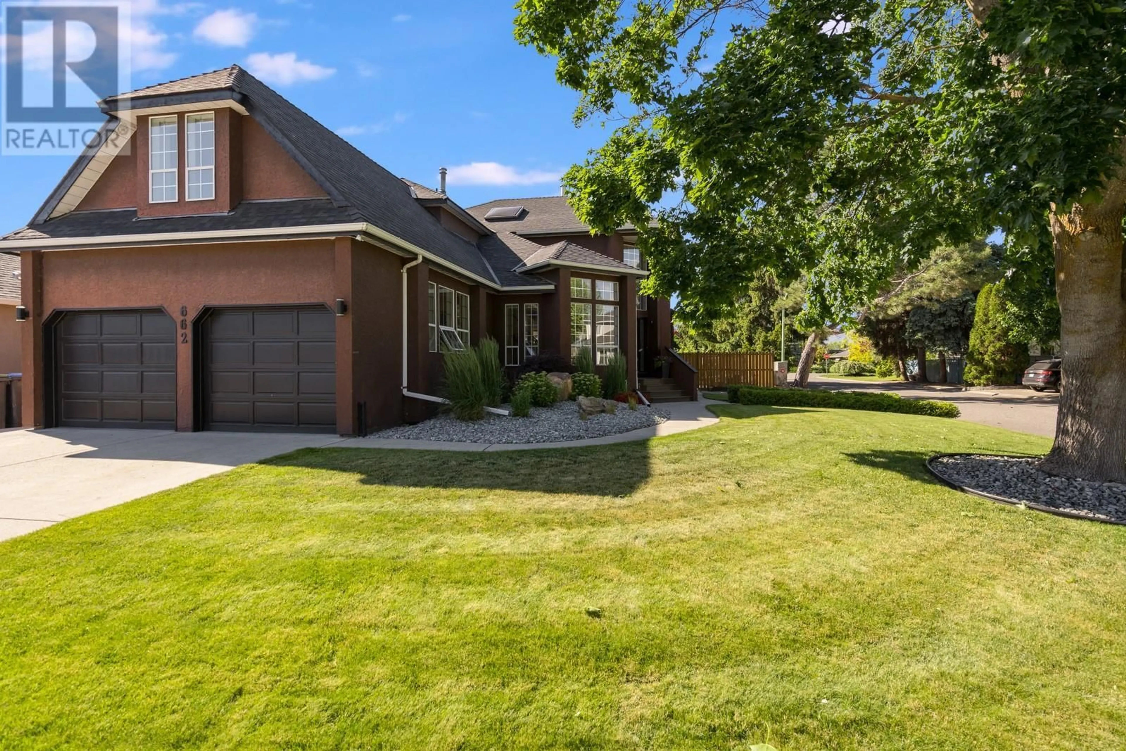 Frontside or backside of a home for 662 Southwind Drive, Kelowna British Columbia V1W8G1