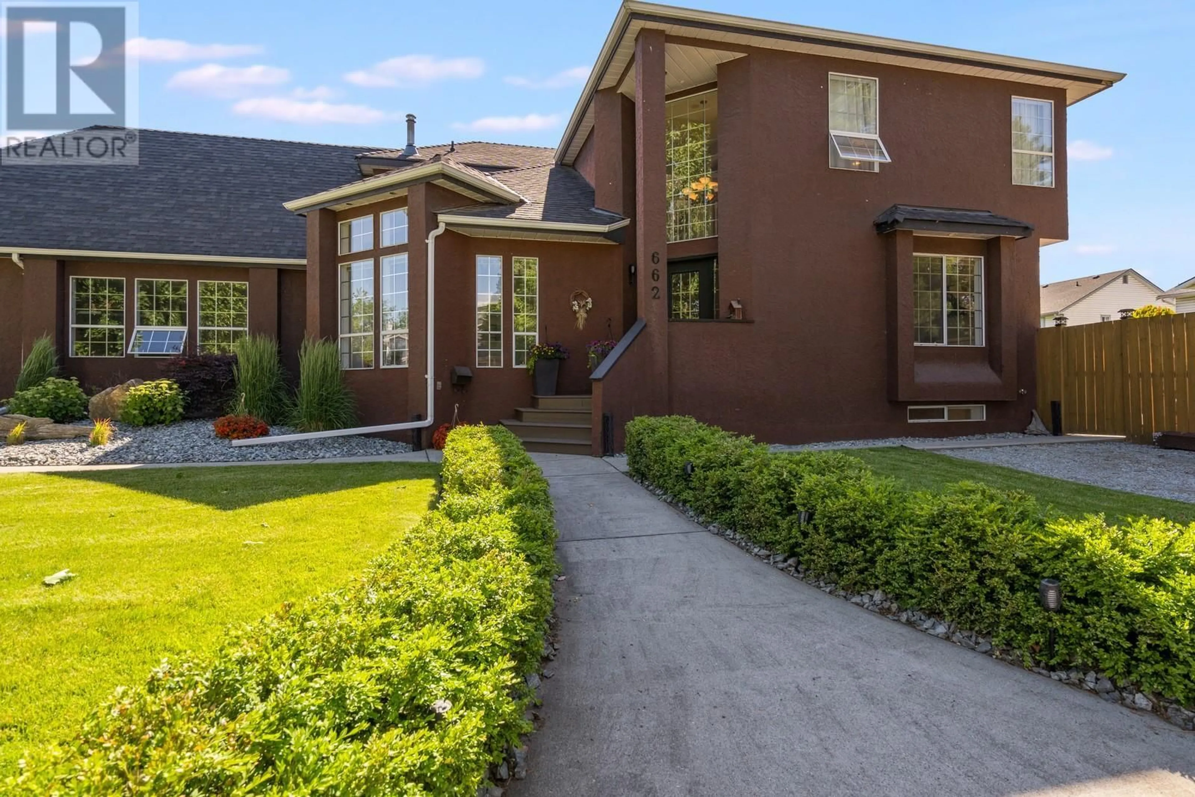 Frontside or backside of a home for 662 Southwind Drive, Kelowna British Columbia V1W8G1