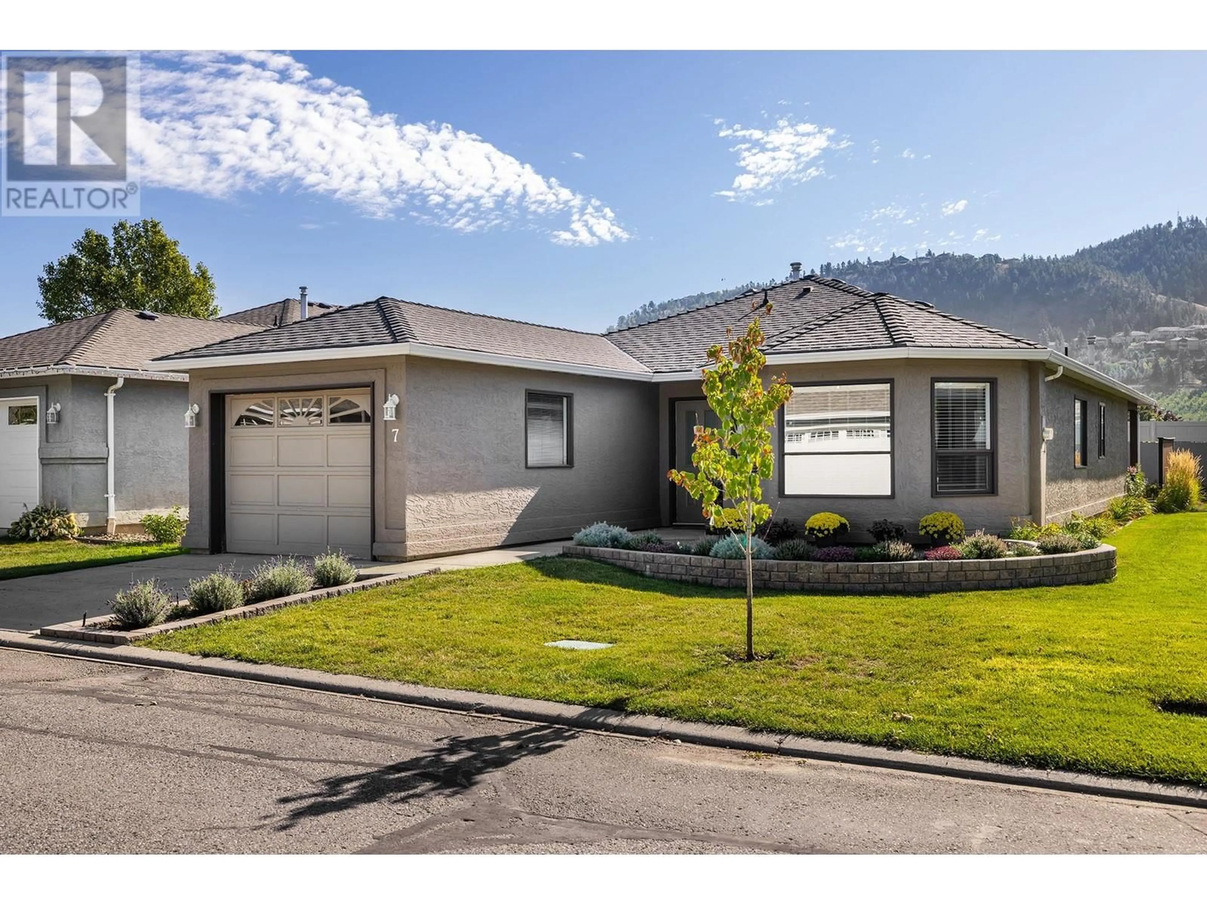 Frontside or backside of a home, the street view for 615 Glenmeadows Road Unit# 7, Kelowna British Columbia V1V1N9