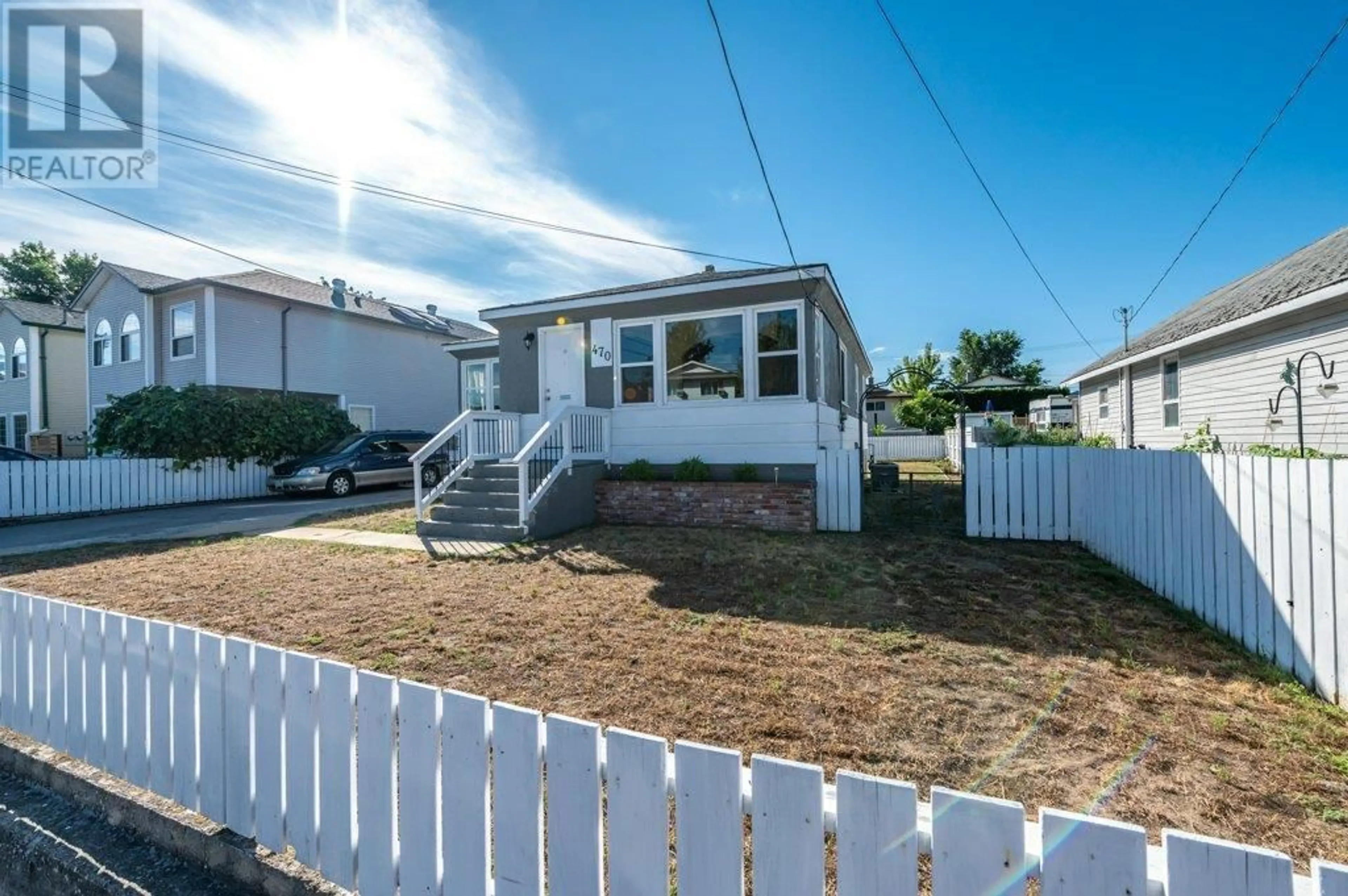 Frontside or backside of a home, the fenced backyard for 470 Heales Avenue, Penticton British Columbia V2A1G4