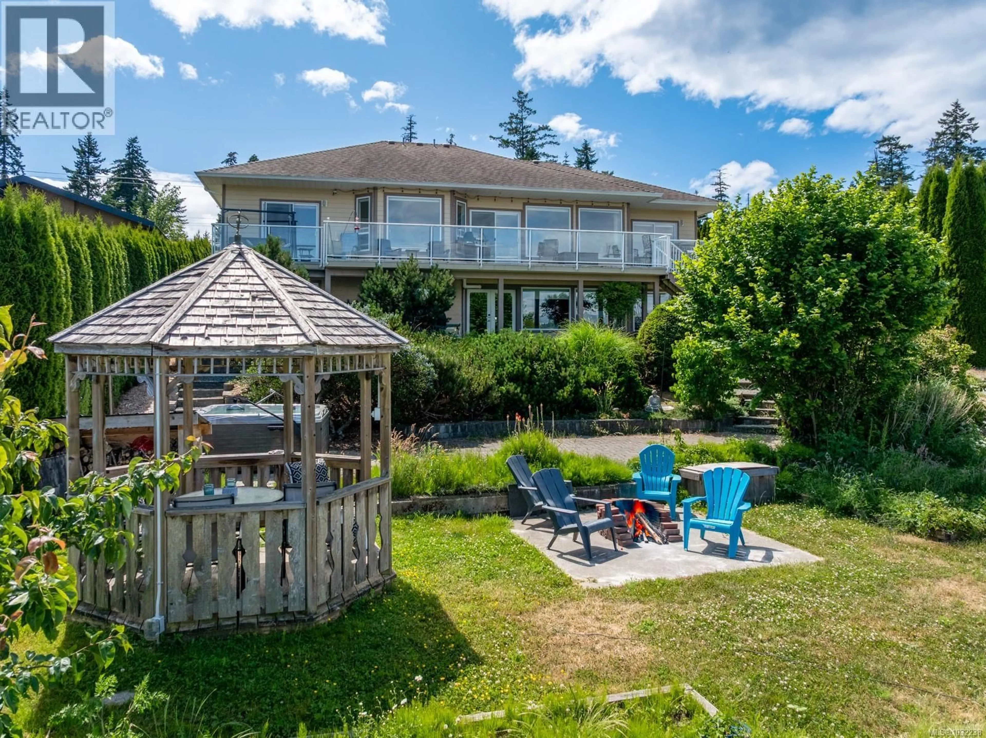 A pic from outside/outdoor area/front of a property/back of a property/a pic from drone, water/lake/river/ocean view for 6800 BUCKLEY BAY FRONTAGE ROAD, Fanny Bay British Columbia V0R1W0