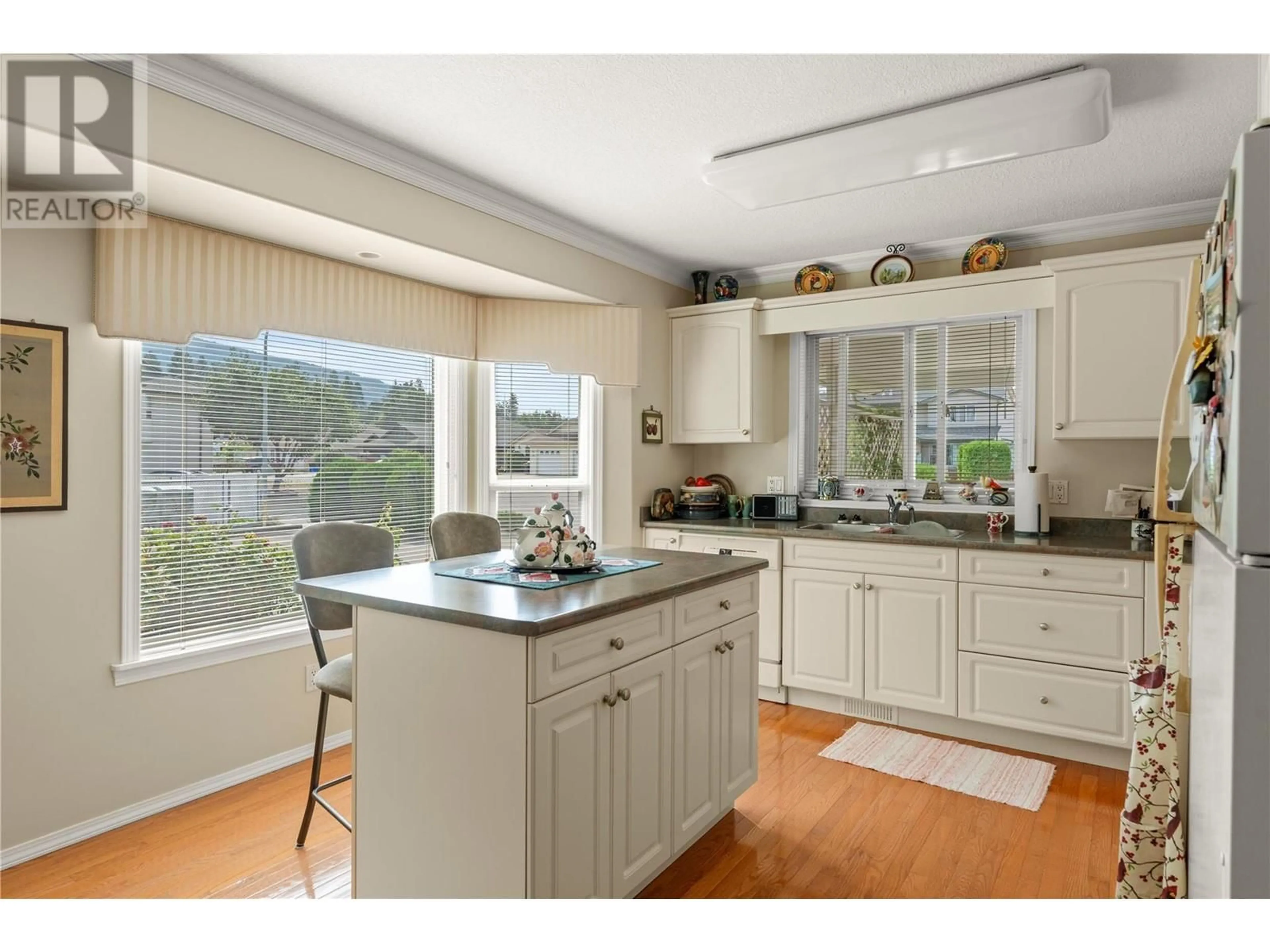 Open concept kitchen, wood/laminate floor for 1834 47 AVENUE, Vernon British Columbia V1T9P3