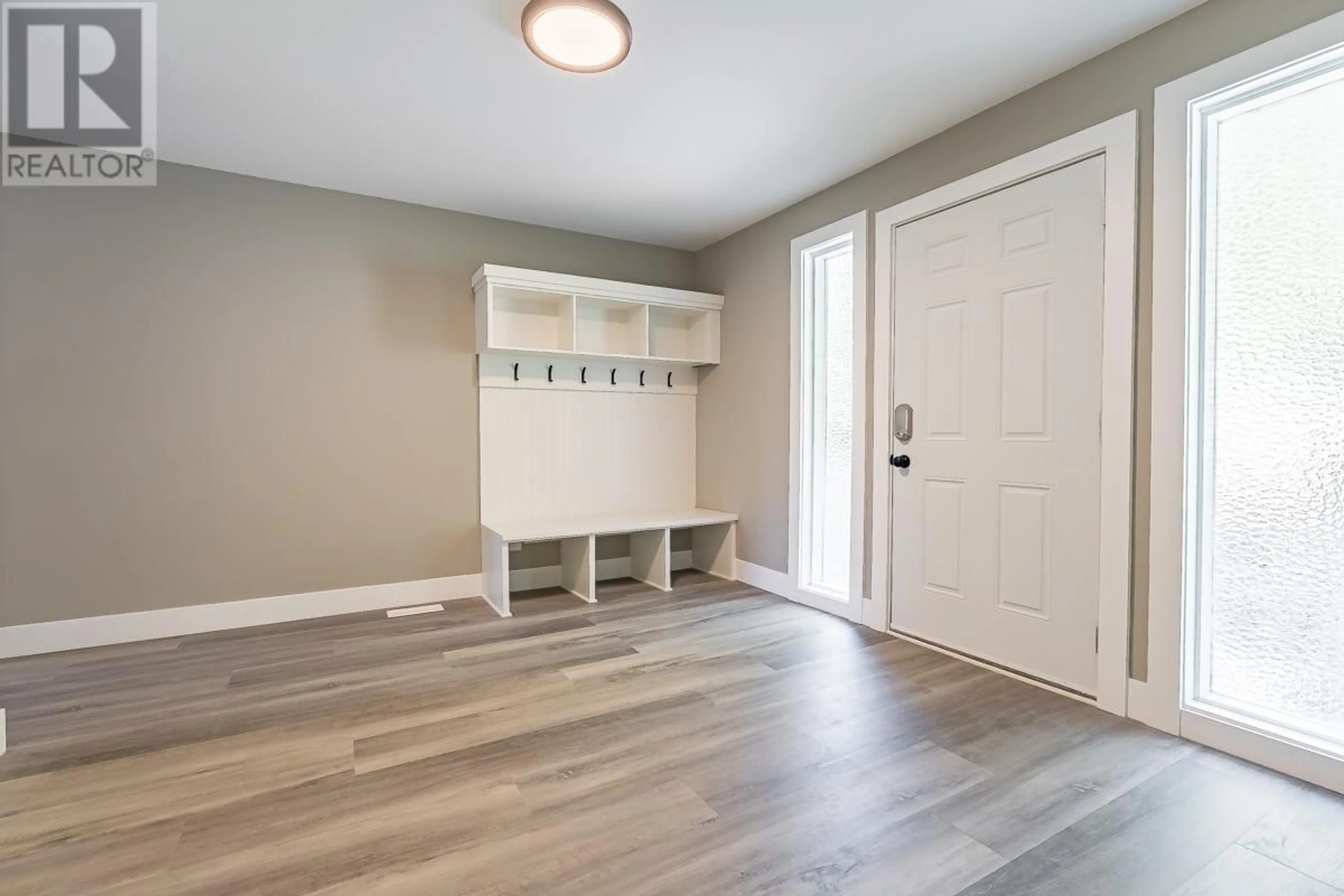 Indoor entryway, wood floors for 7430 Crowfoot Drive, Anglemont British Columbia V0E1M8