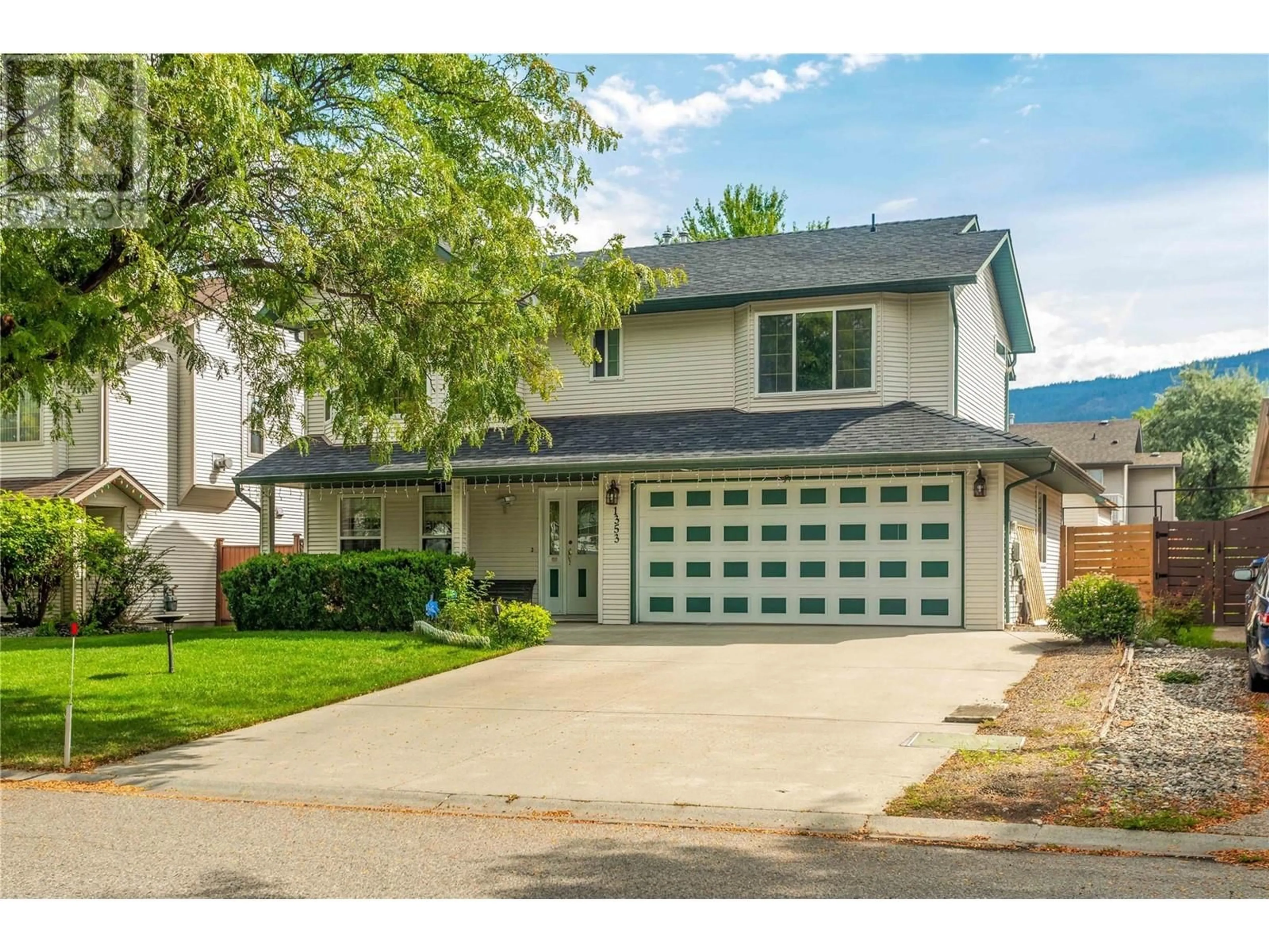 Frontside or backside of a home, the street view for 1353 Friesen Road, Kelowna British Columbia V1X7P3