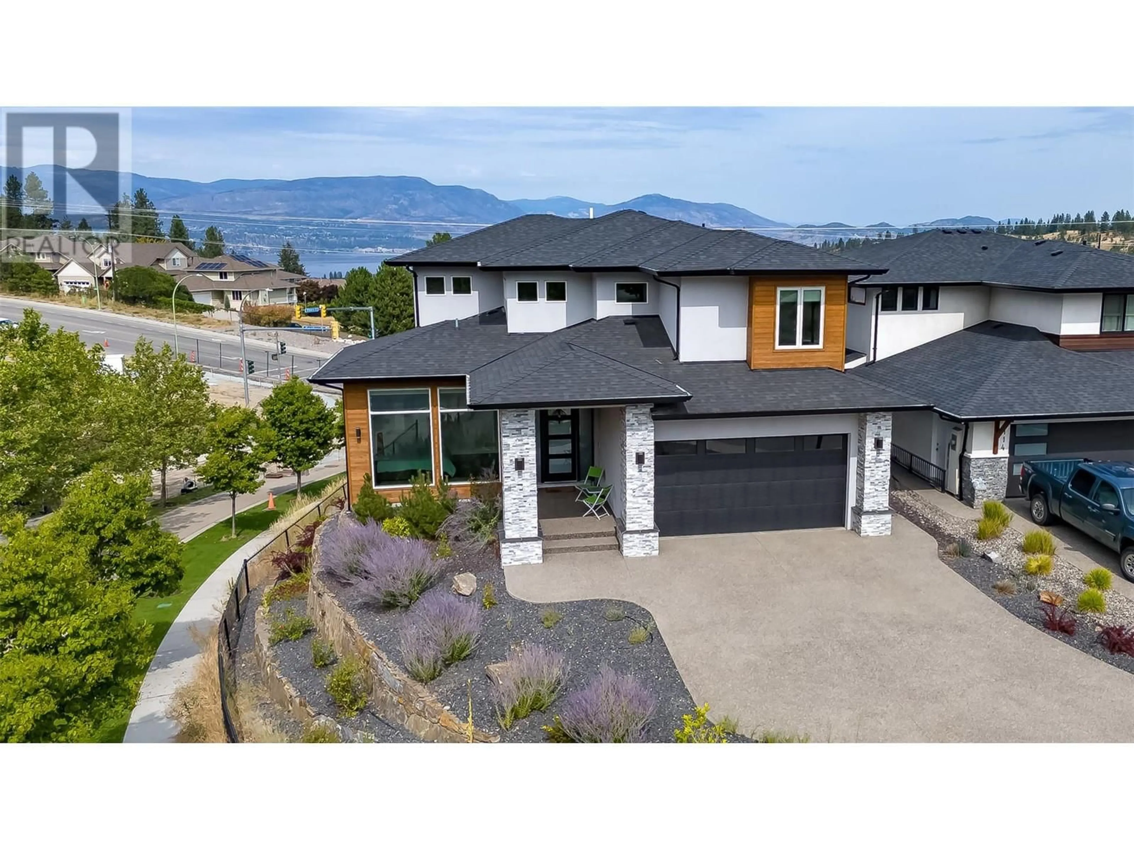 Frontside or backside of a home, the street view for 1110 Goldfinch Place, Kelowna British Columbia V1W5M1