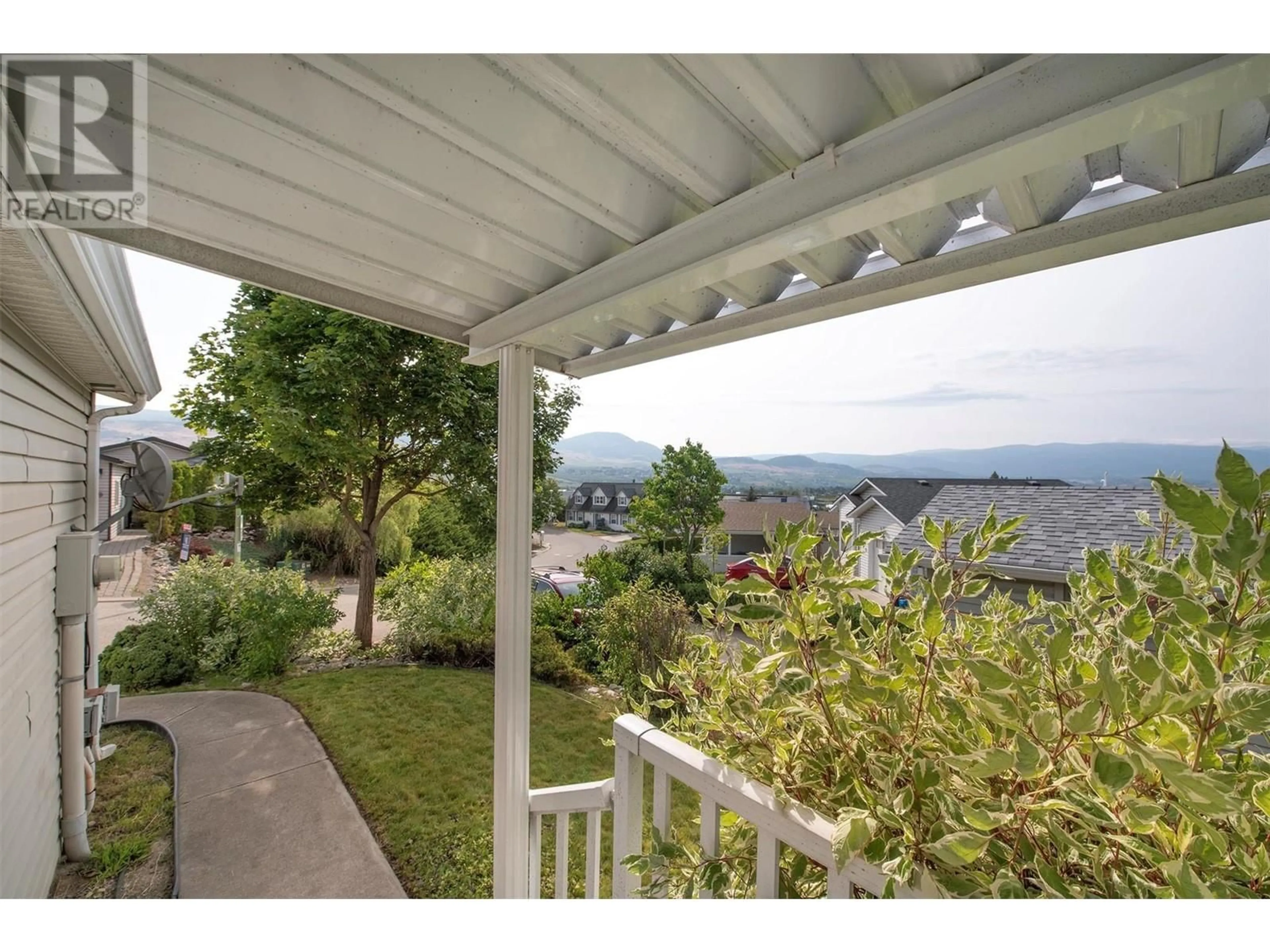 Patio, the fenced backyard for 2550 Hollywood Road Unit# 104, Kelowna British Columbia V1V2S6