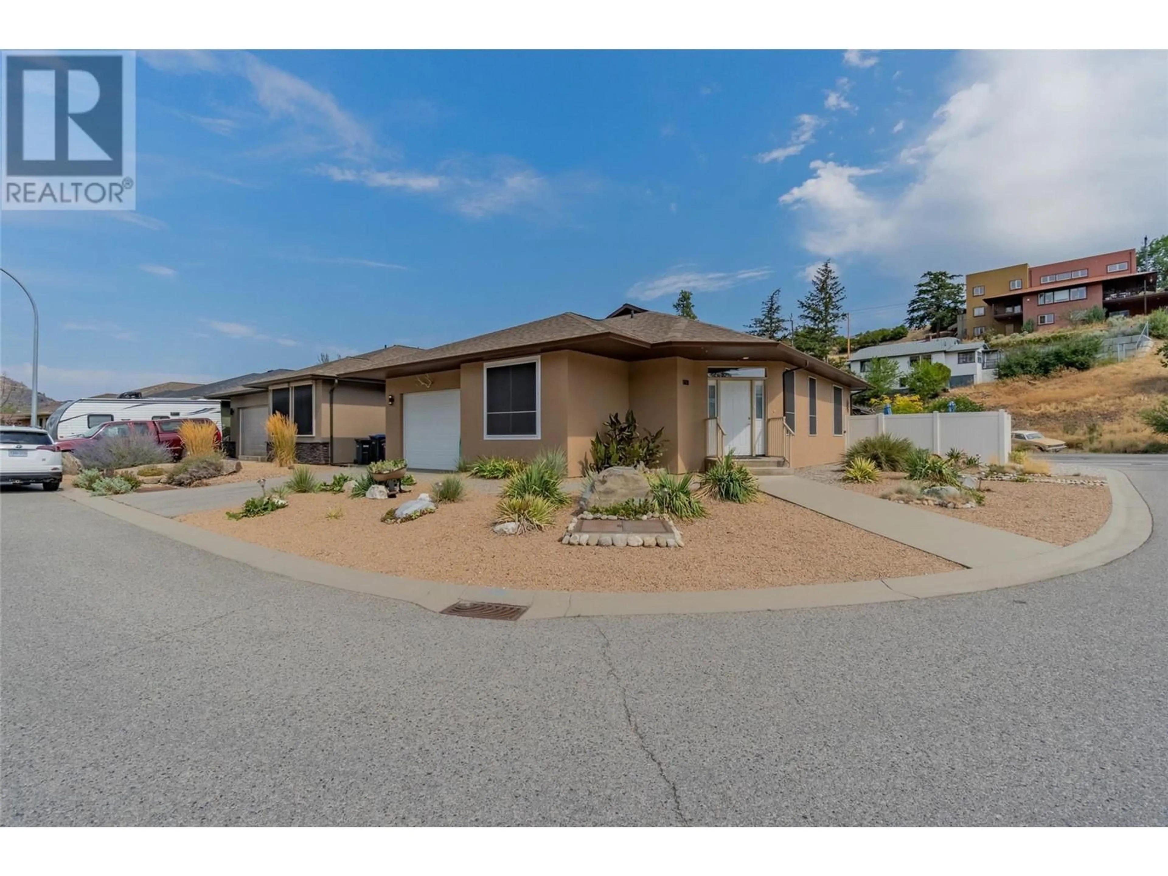 Frontside or backside of a home, the street view for 6609 OXBOW Crescent, Oliver British Columbia V0H1T4