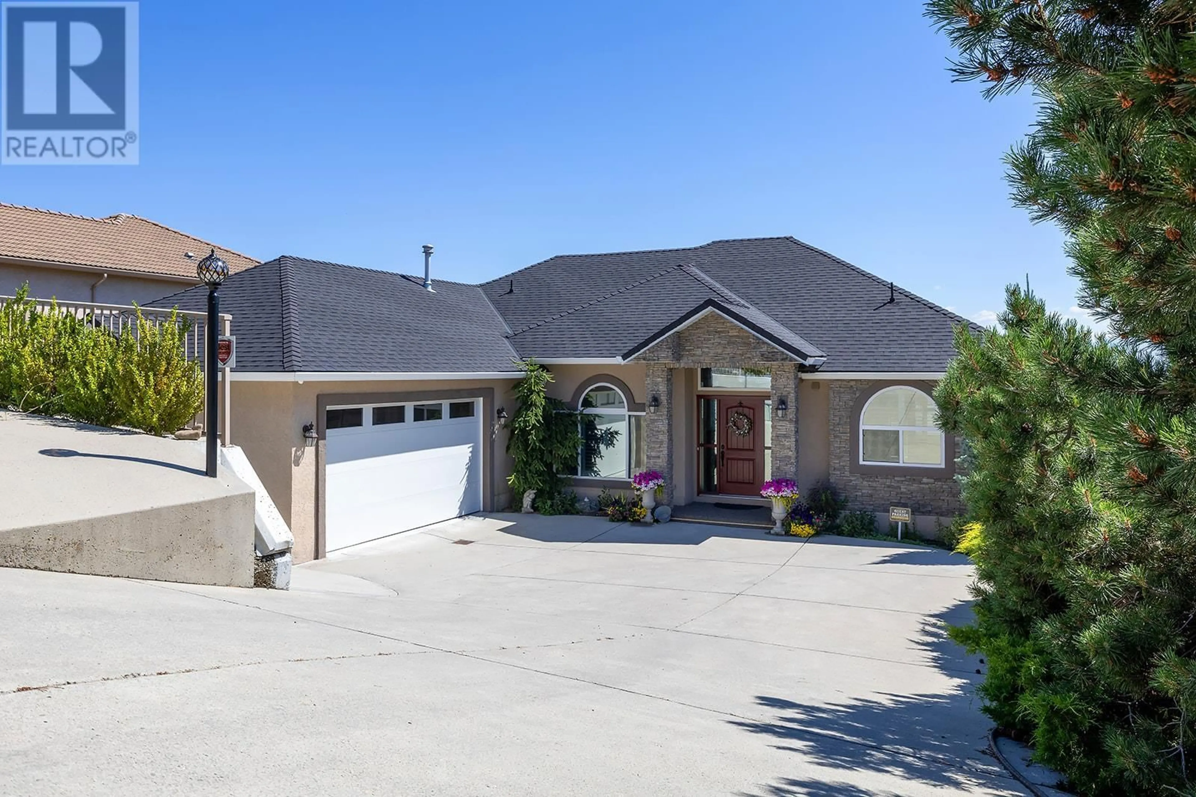 Frontside or backside of a home, the street view for 3576 Royal Gala Drive, West Kelowna British Columbia V4T2M4