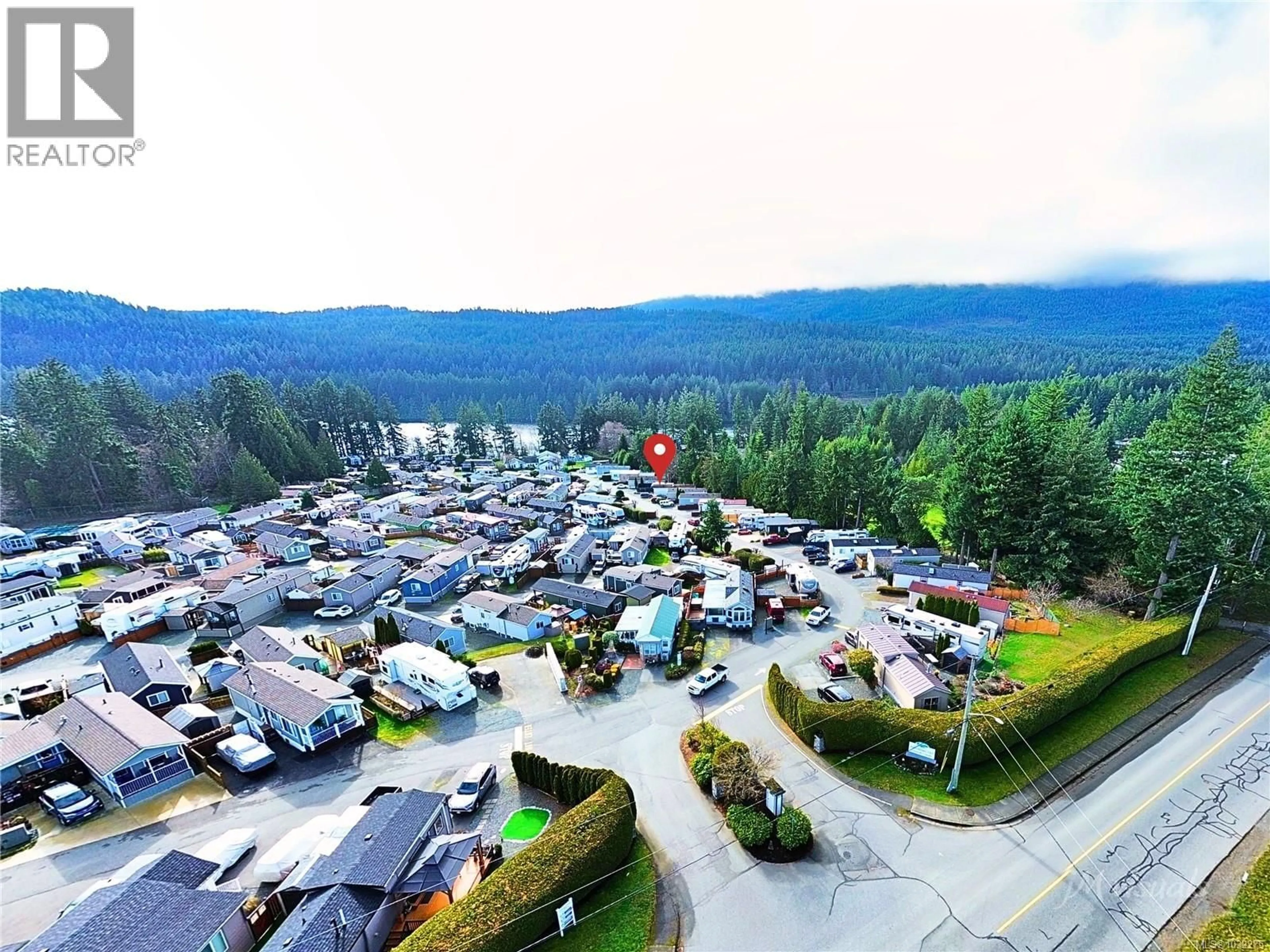 A pic from outside/outdoor area/front of a property/back of a property/a pic from drone, mountain view for 1128 WOSS LAKE DRIVE, Nanaimo British Columbia V9R6X7