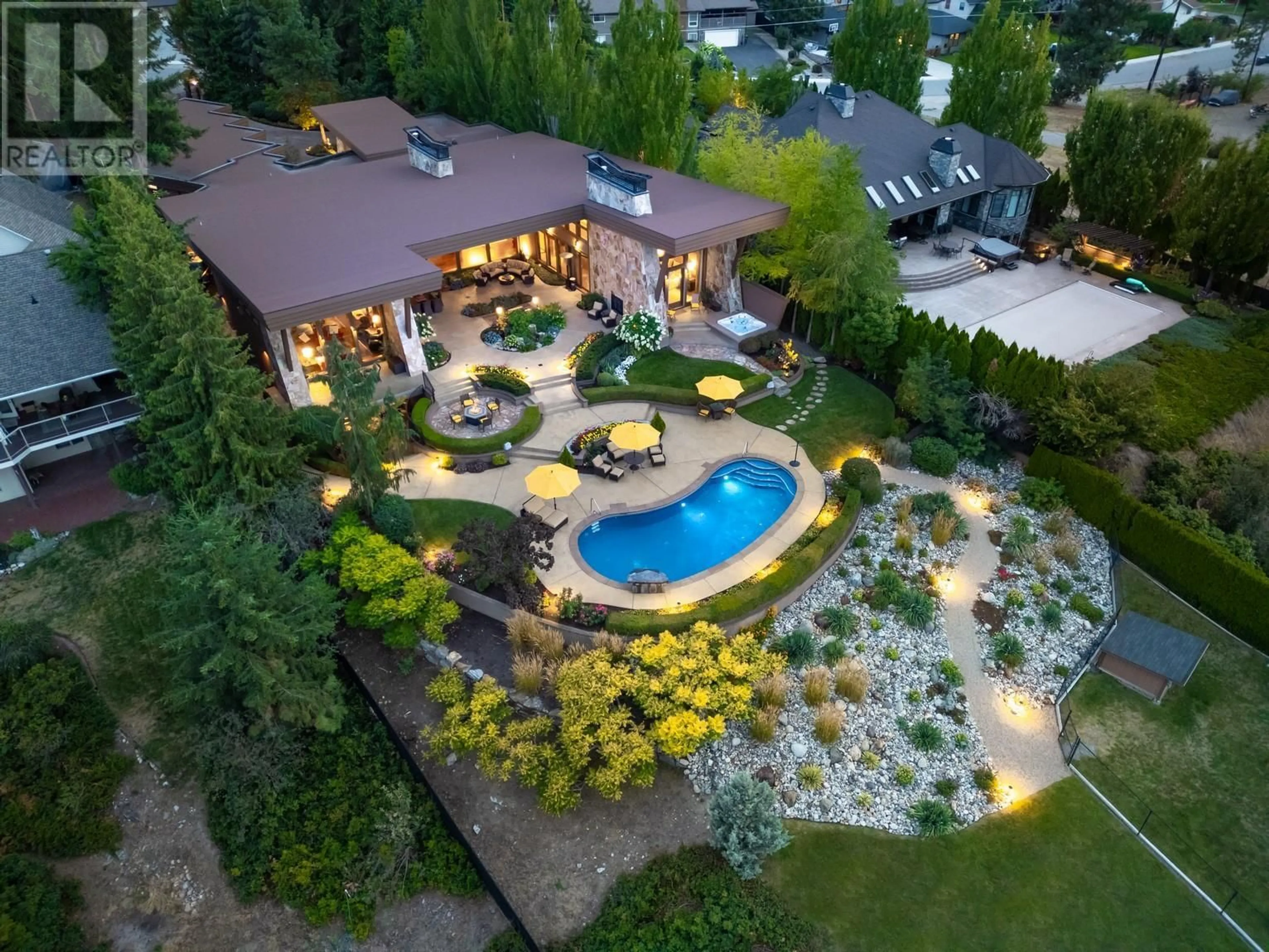 A pic from outside/outdoor area/front of a property/back of a property/a pic from drone, unknown for 704 BARNABY ROAD, Kelowna British Columbia V1W4N9
