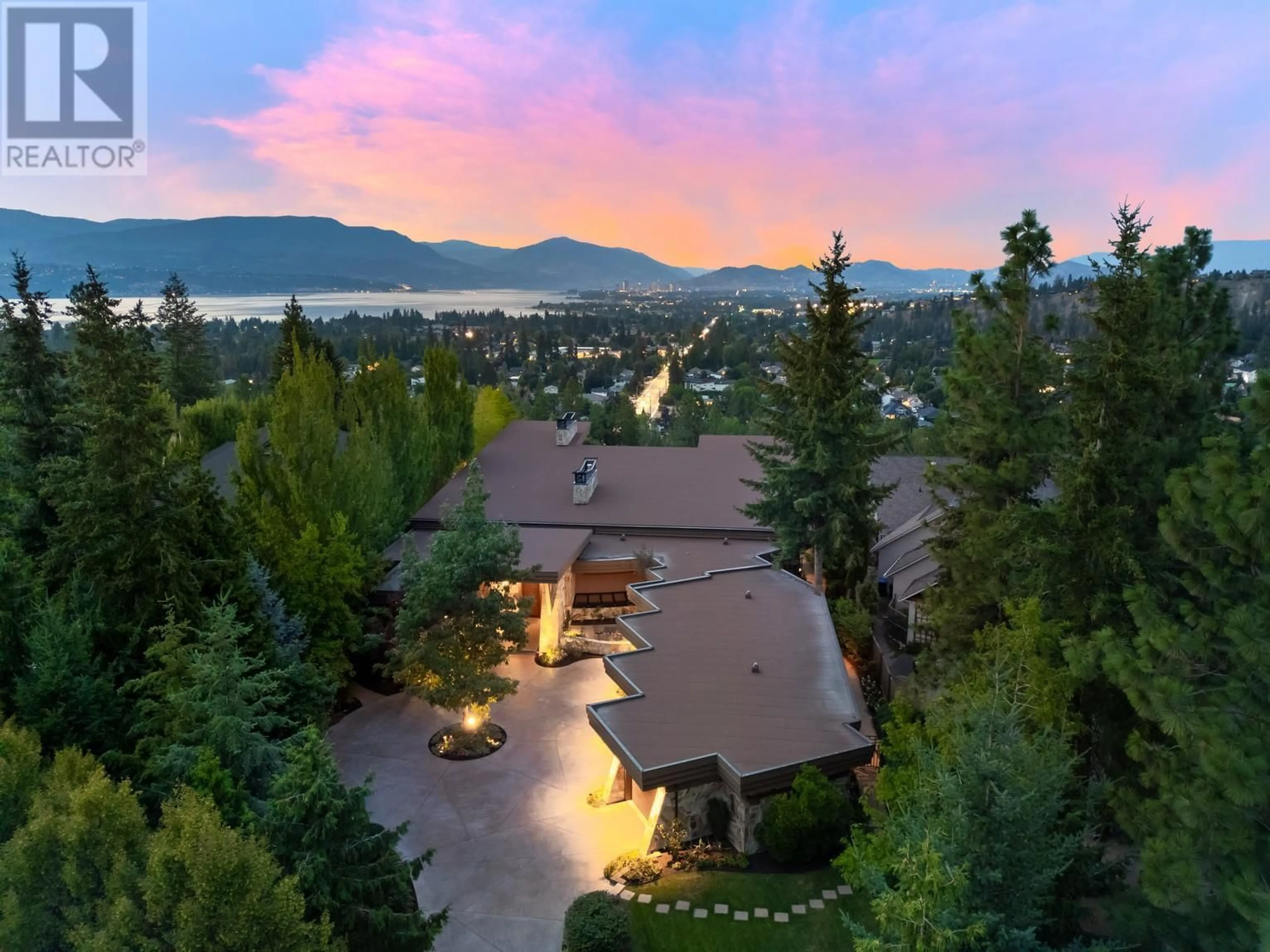 A pic from outside/outdoor area/front of a property/back of a property/a pic from drone, mountain view for 704 BARNABY ROAD, Kelowna British Columbia V1W4N9