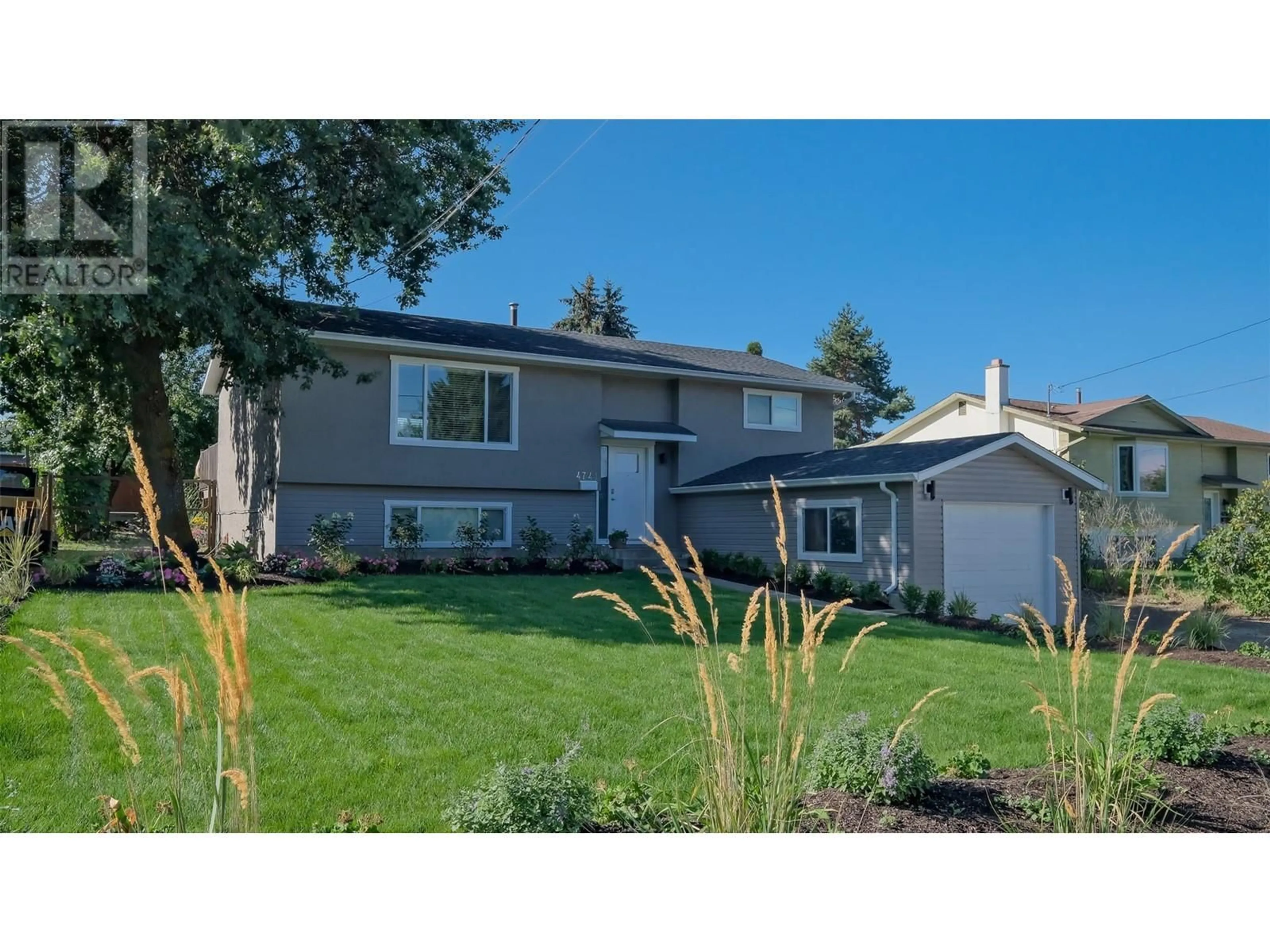 Frontside or backside of a home, the fenced backyard for 4741 Parkdale Crescent, Kelowna British Columbia V1X6T4