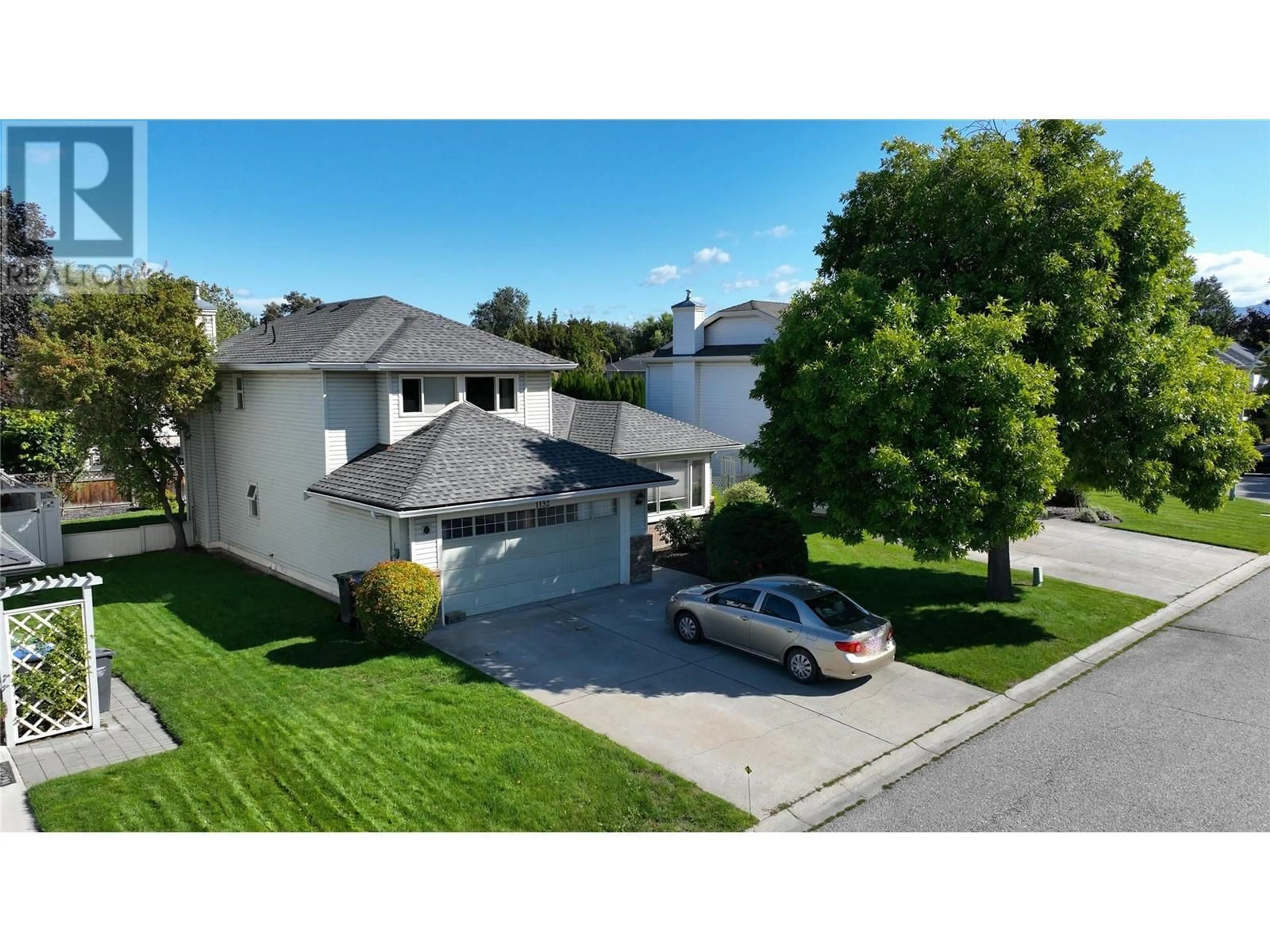 Frontside or backside of a home, the street view for 1132 WINTERGREEN Drive, Kelowna British Columbia V1W3V7