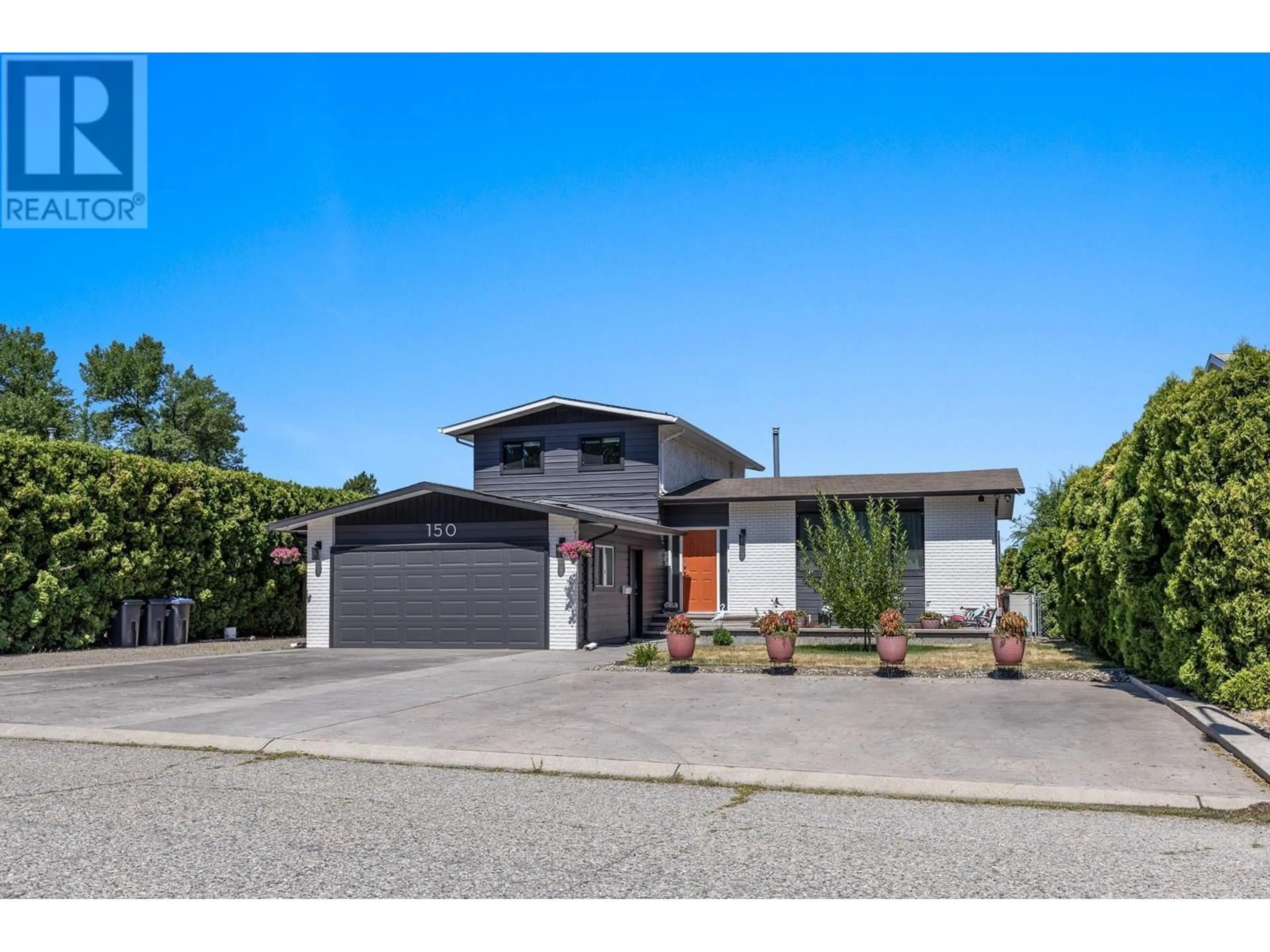 Frontside or backside of a home, the street view for 150 Jupiter Court, Kelowna British Columbia V1X5W5