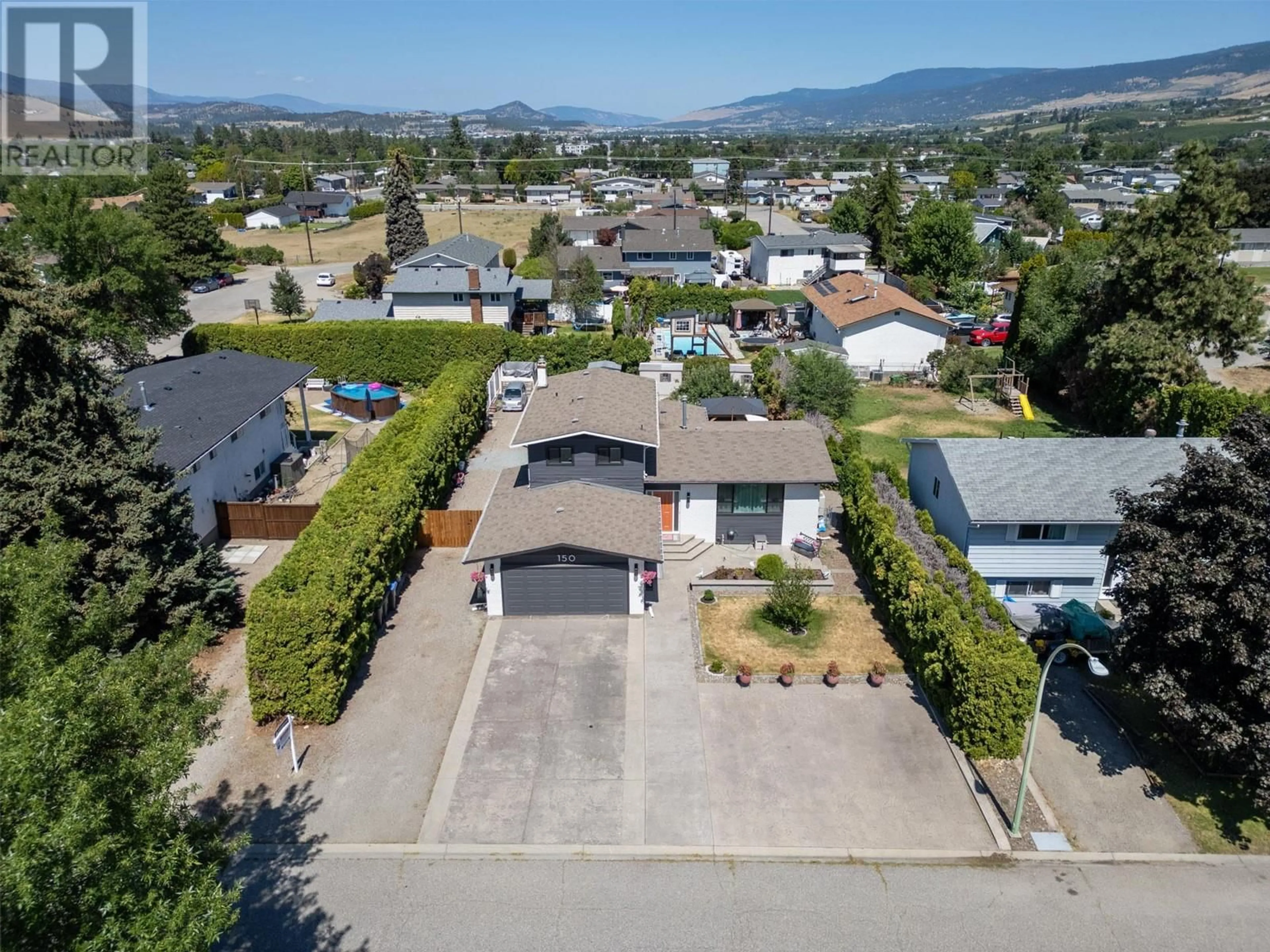 Frontside or backside of a home, the street view for 150 Jupiter Court, Kelowna British Columbia V1X5W5