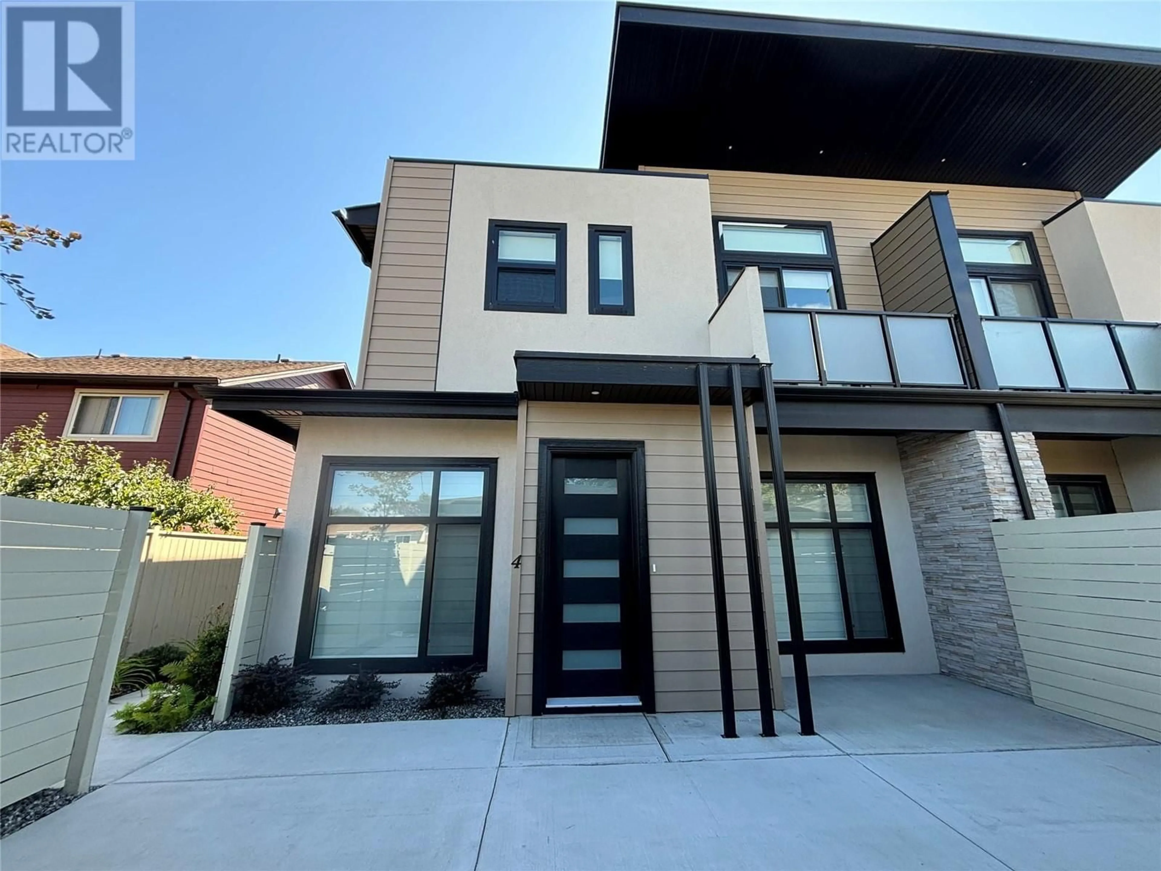 Frontside or backside of a home, the front or back of building for 840 Wardlaw Avenue Unit# 4, Kelowna British Columbia V1Y5B9