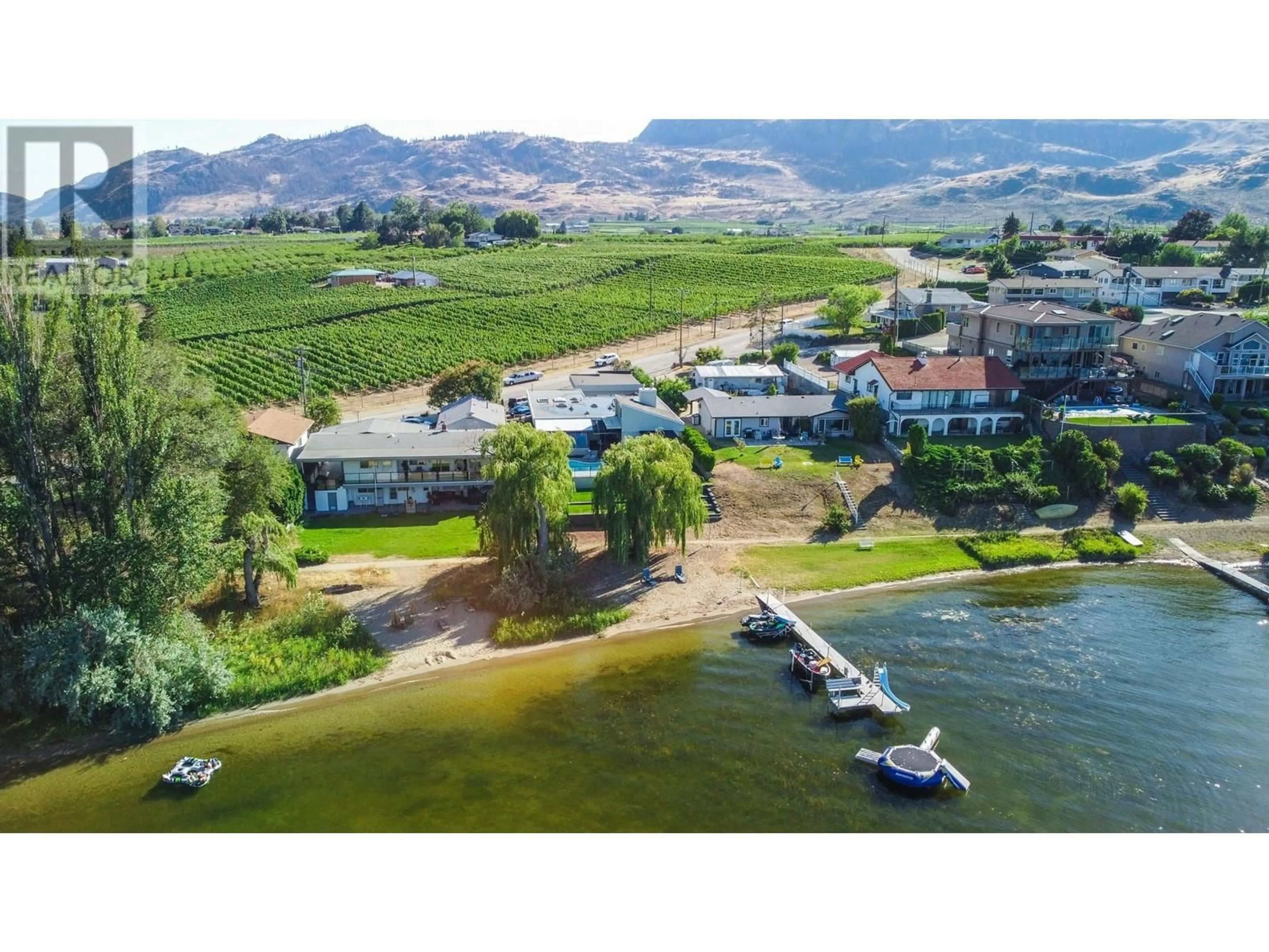 A pic from outside/outdoor area/front of a property/back of a property/a pic from drone, water/lake/river/ocean view for 8516 32nd Avenue, Osoyoos British Columbia V0H1V1