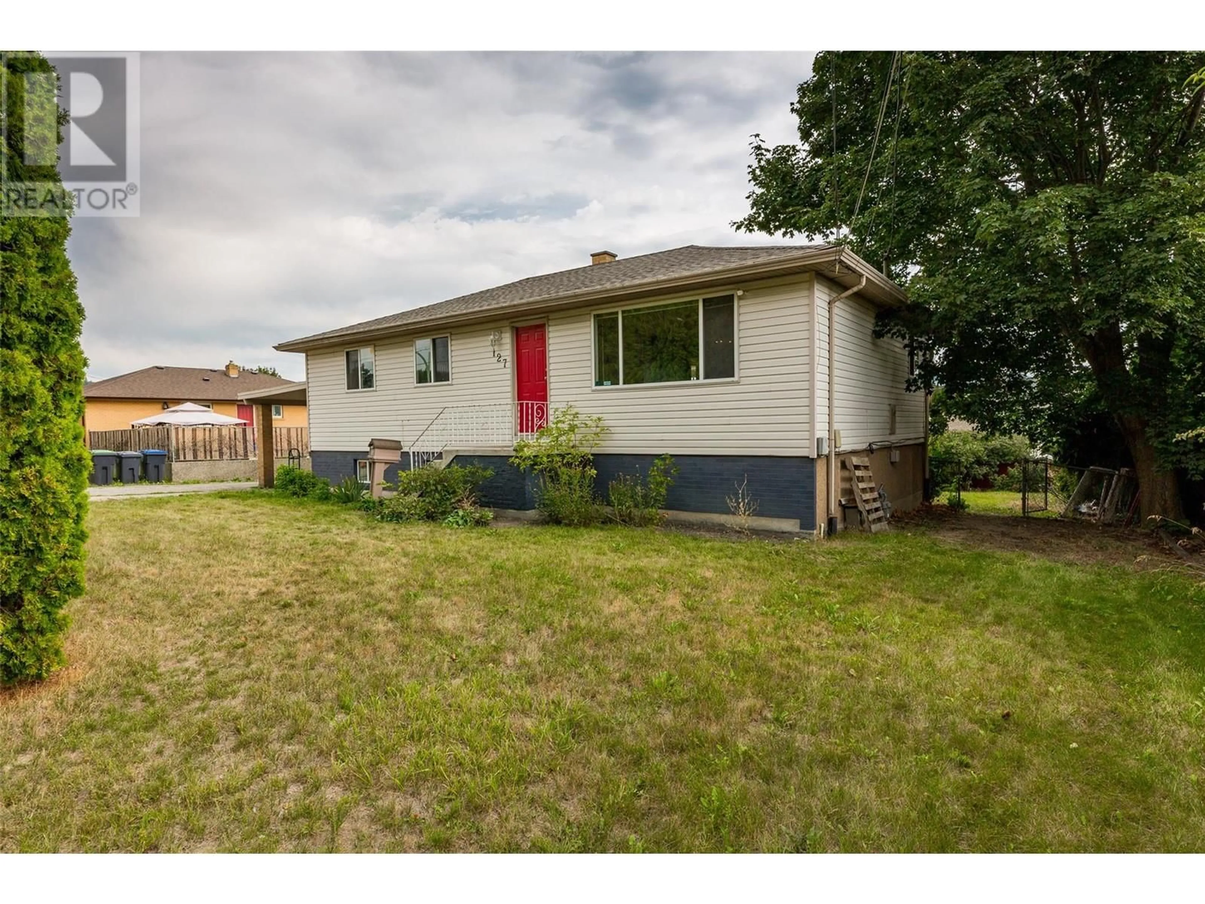 Frontside or backside of a home, the fenced backyard for 127 Snowsell Street, Kelowna British Columbia V1V1Z1