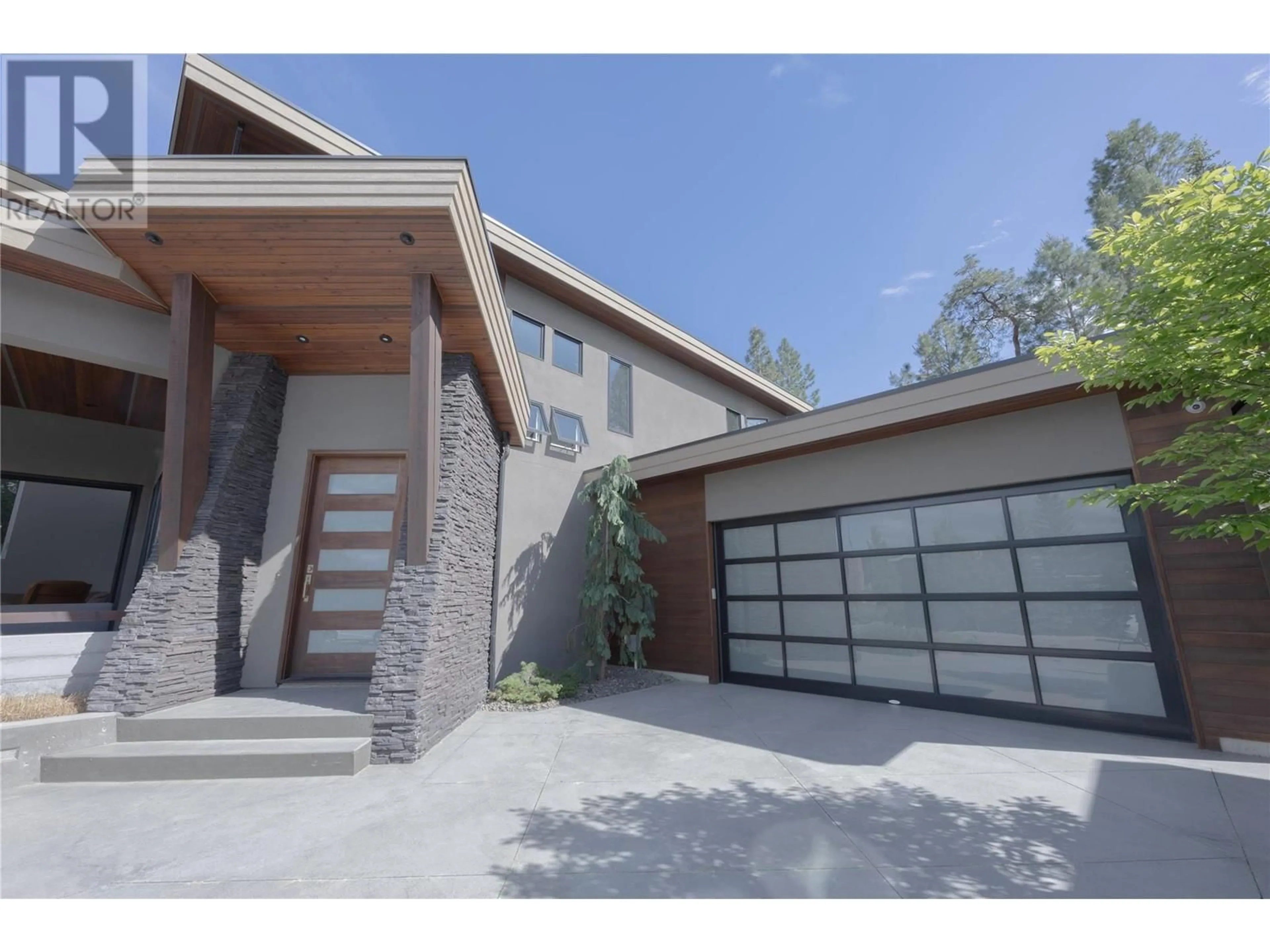 Frontside or backside of a home, the street view for 1067 Westpoint Drive, Kelowna British Columbia V1W4Z9