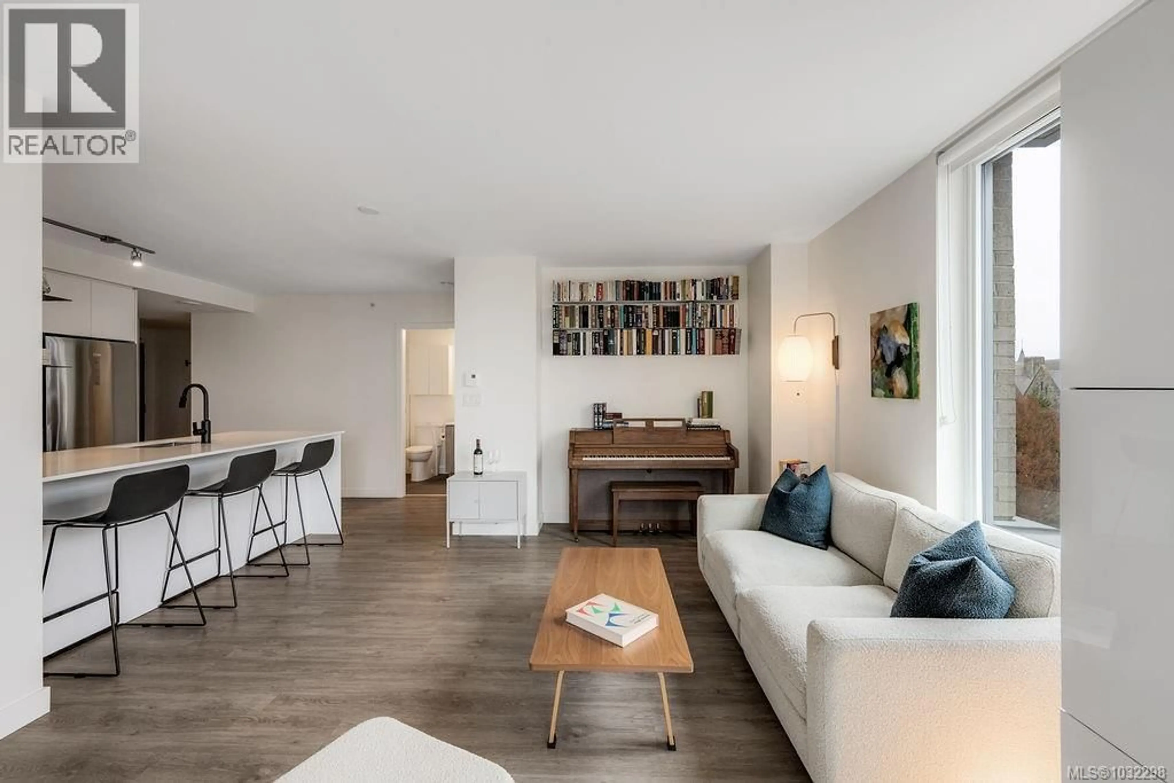 Living room with furniture, wood/laminate floor for 604 - 845 JOHNSON STREET, Victoria British Columbia V8W0G3