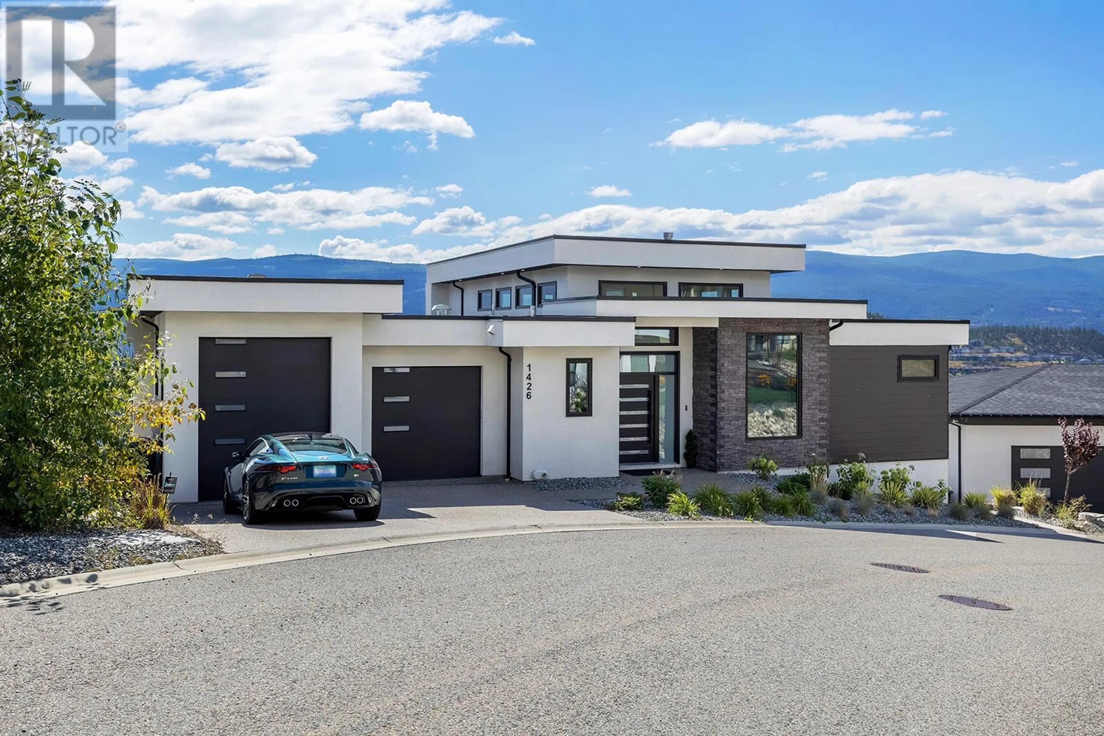 Frontside or backside of a home, the street view for 1426 Mine Hill Lane, Kelowna British Columbia V1P1T6