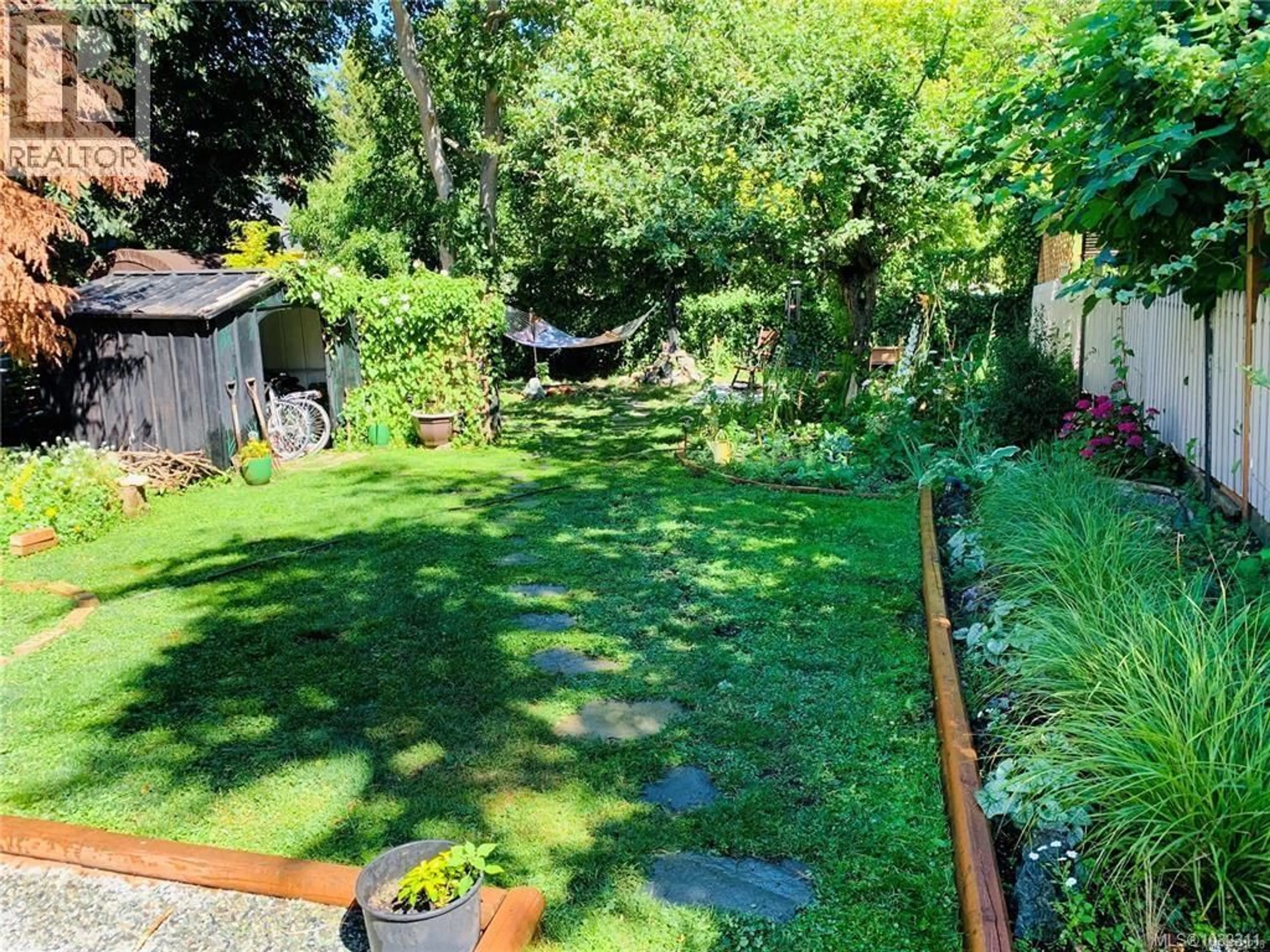 A pic from outside/outdoor area/front of a property/back of a property/a pic from drone, forest/trees view for 1709 FERNWOOD ROAD, Victoria British Columbia V8T2Y3