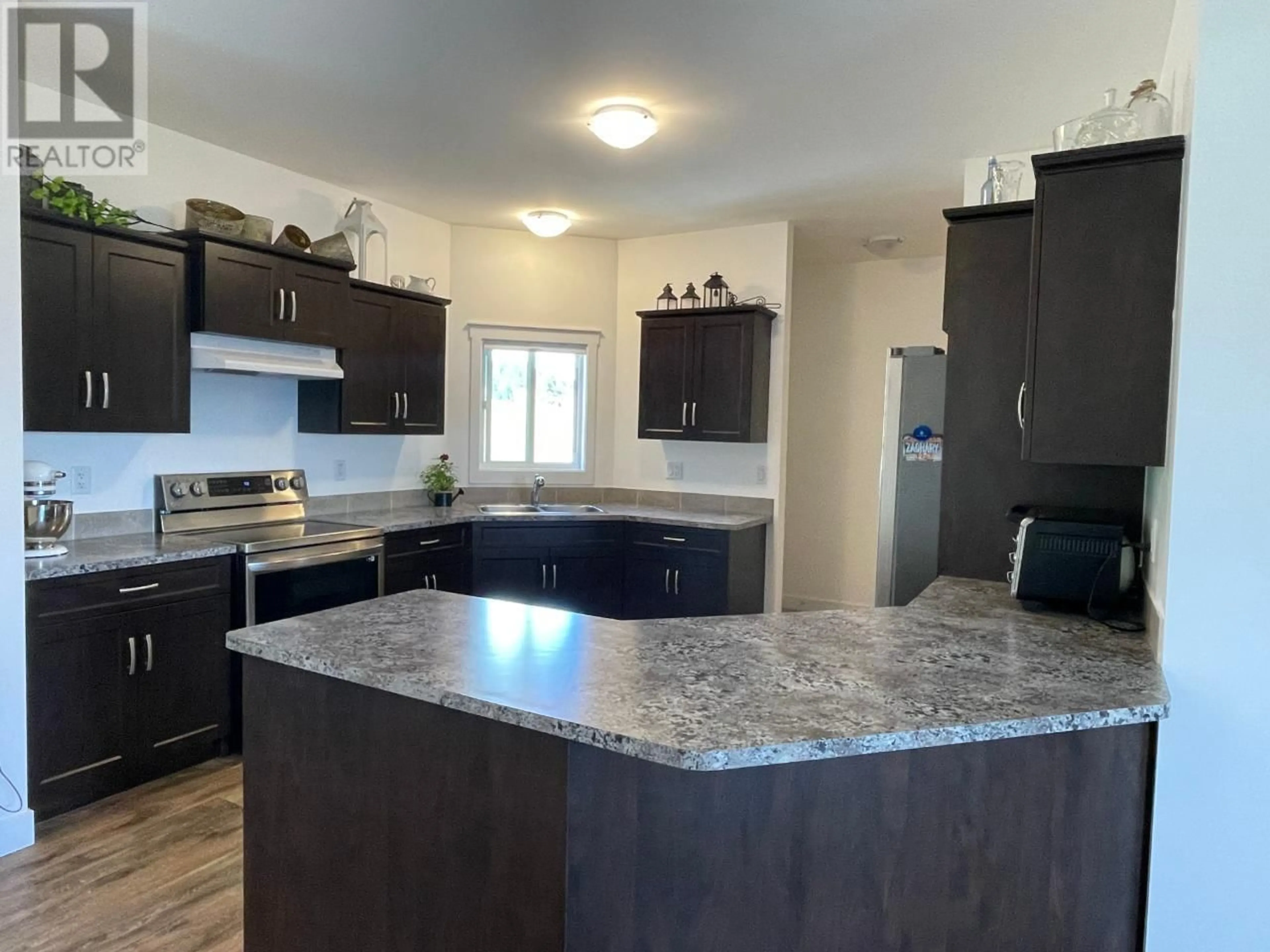 Open concept kitchen for 1826 HULME CREEK Road, Rock Creek British Columbia V0H1Y0